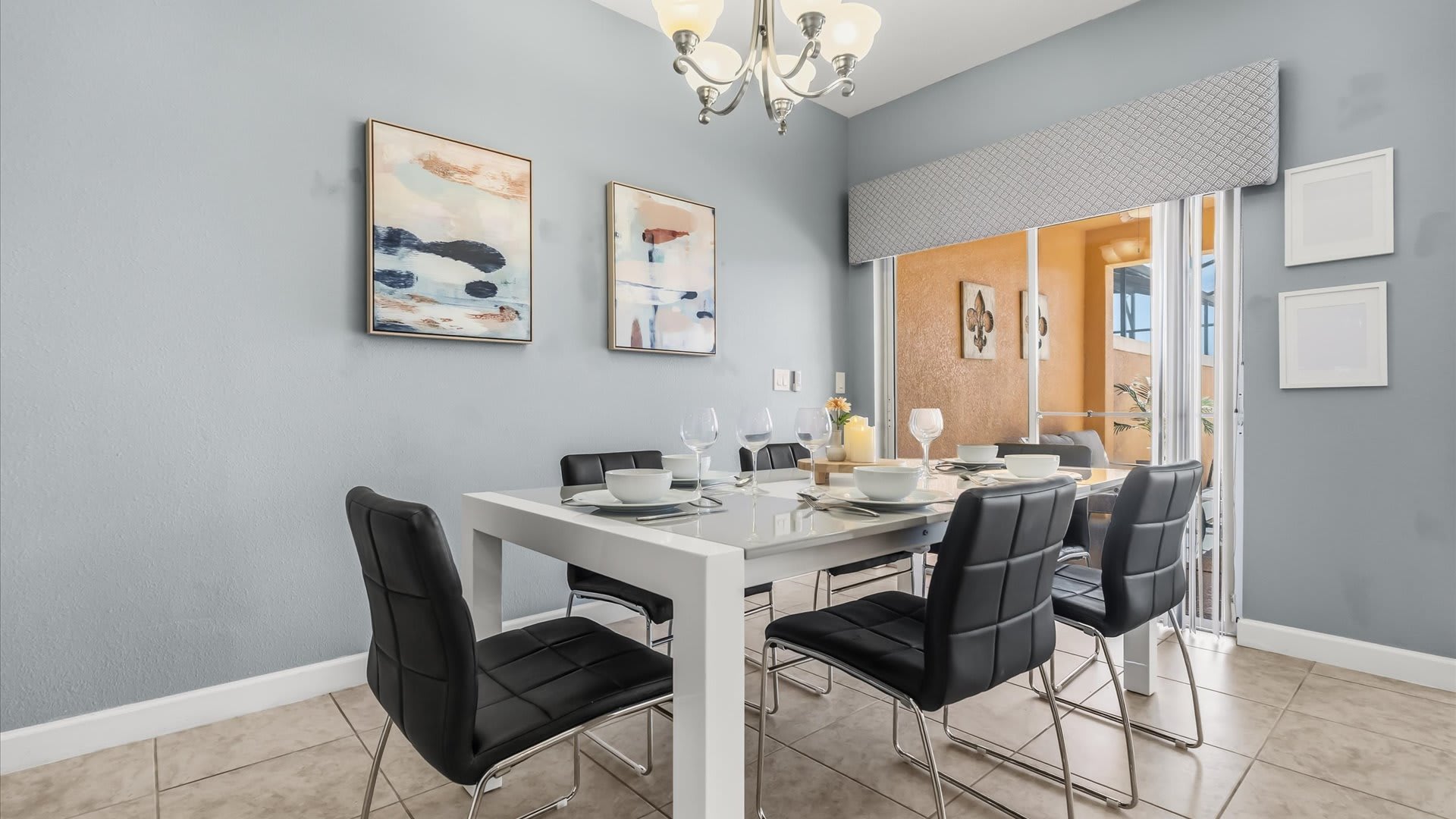 Dining Space: Gather for meals at the dining table with pool views and open flow to the kitchen.