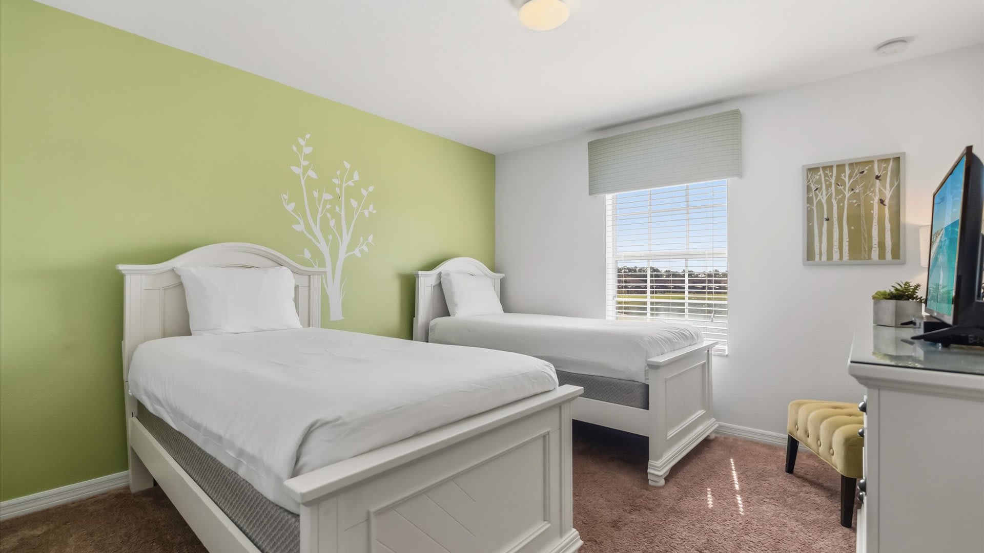 Vibrant Twin Bedroom offering peaceful nights with a smart TV.