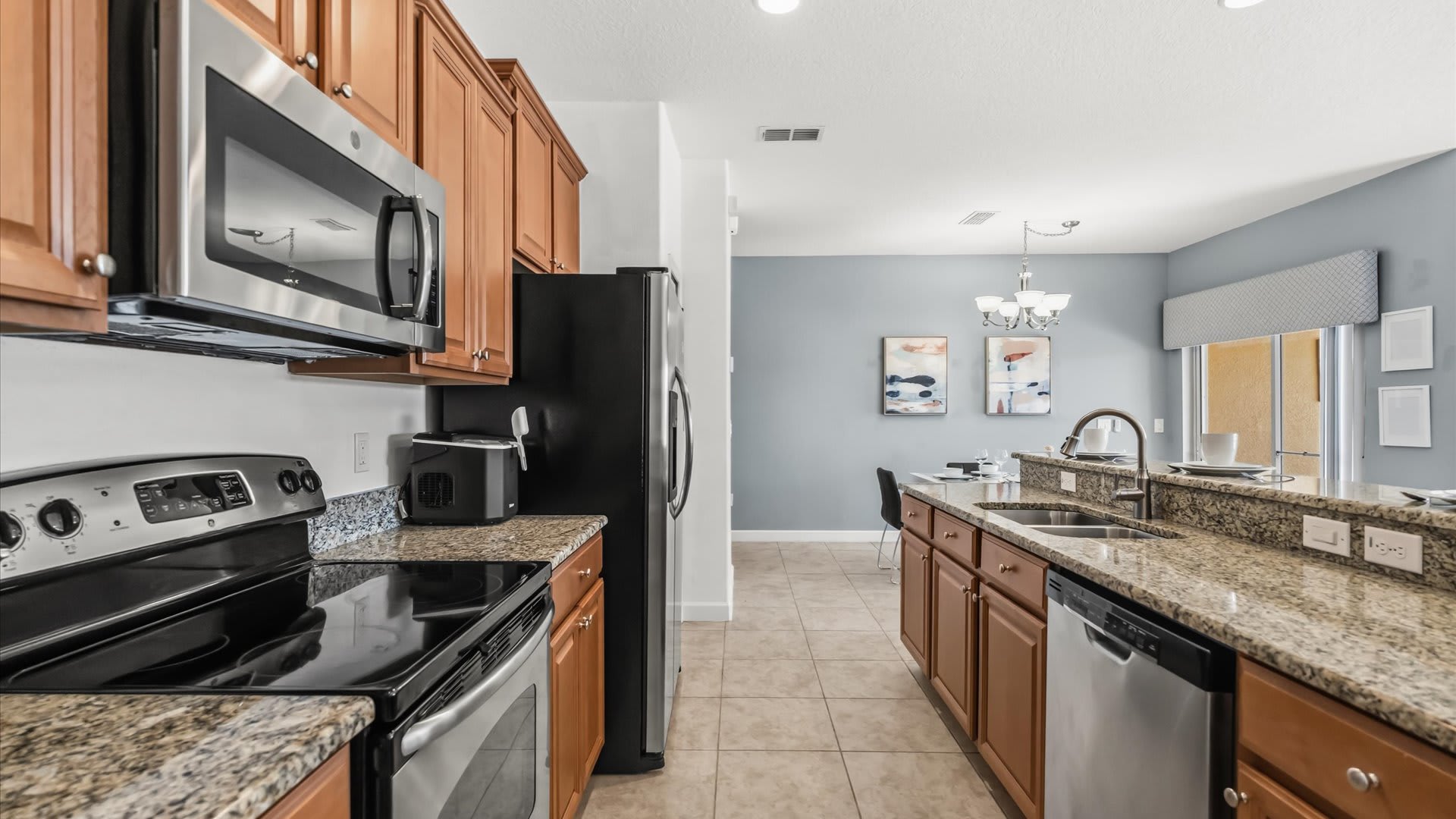 Fully Equipped Kitchen: Cook your favourite meals in this modern kitchen featuring stainless steel appliances and granite countertops.