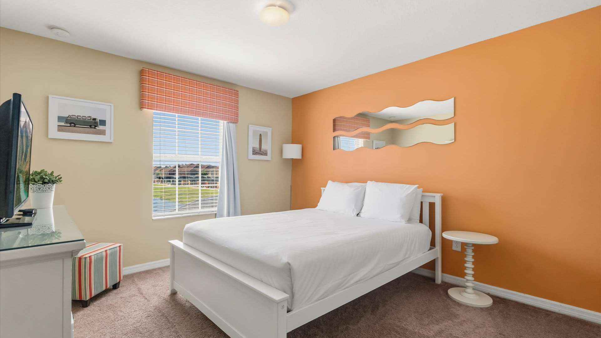 Peaceful and stylish room with a queen bed and shared bathroom access.