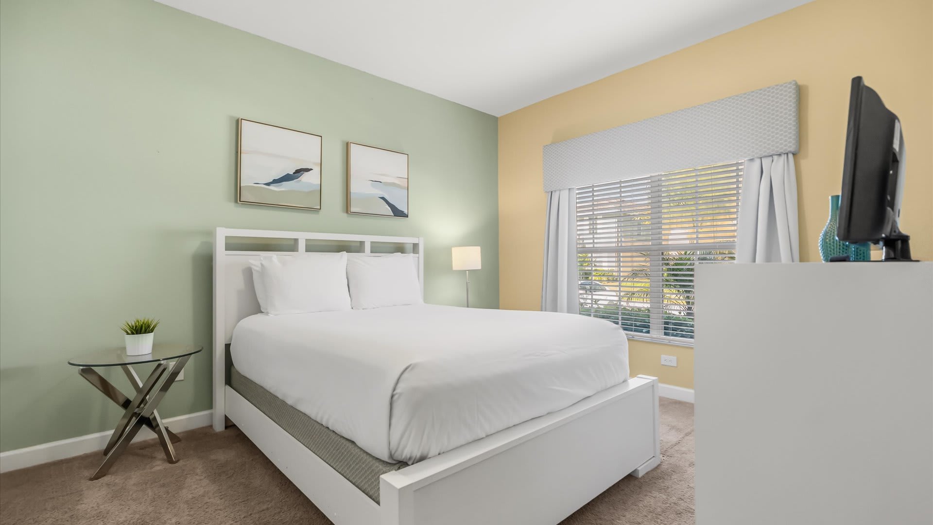 Cosy bedroom with a comfortable queen bed and adjacent bathroom for convenience.