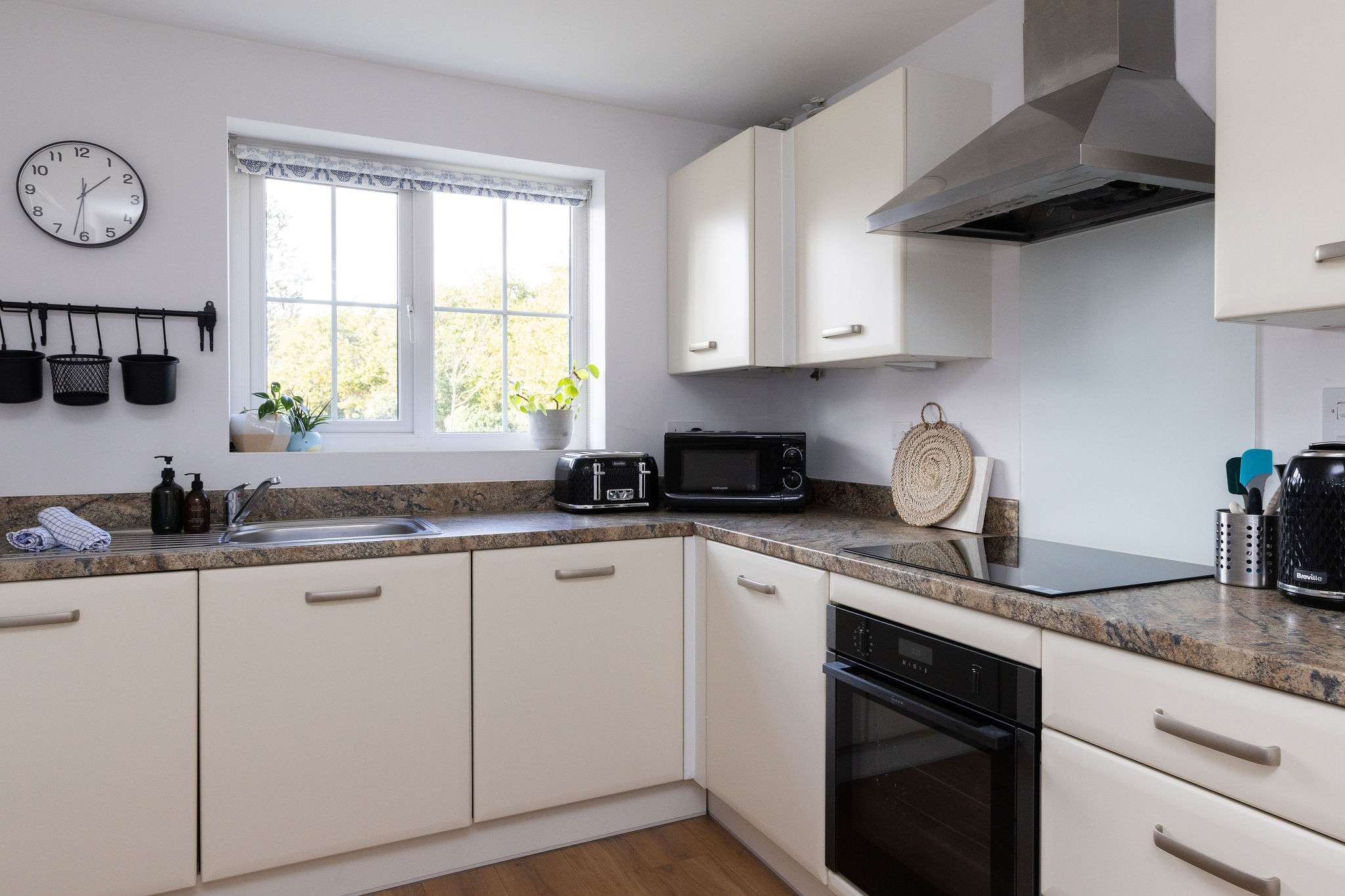 The bright kitchen has everything you need to cook meals and prepare picnics.