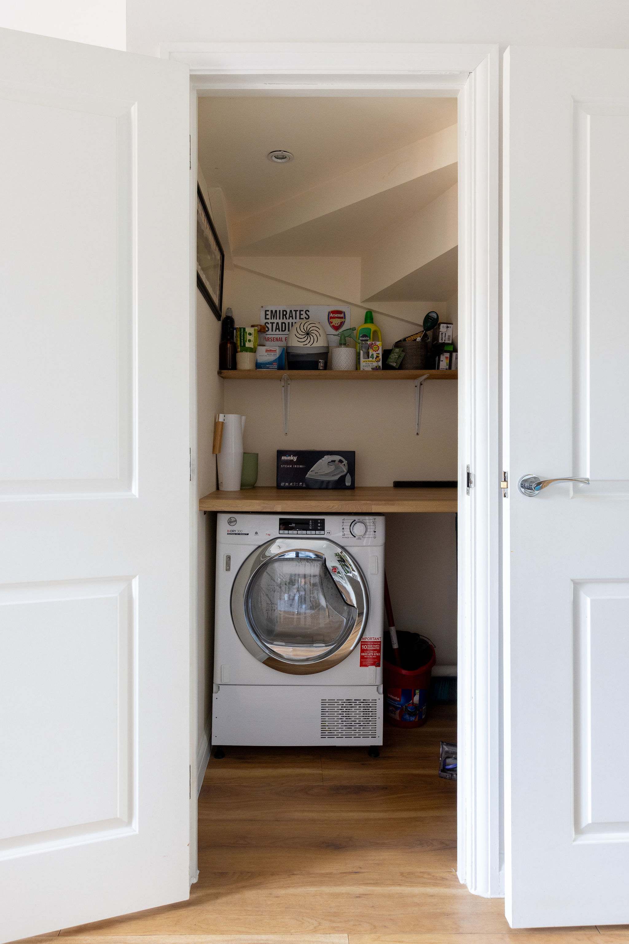 Convenient utility nook with tumble dryer.