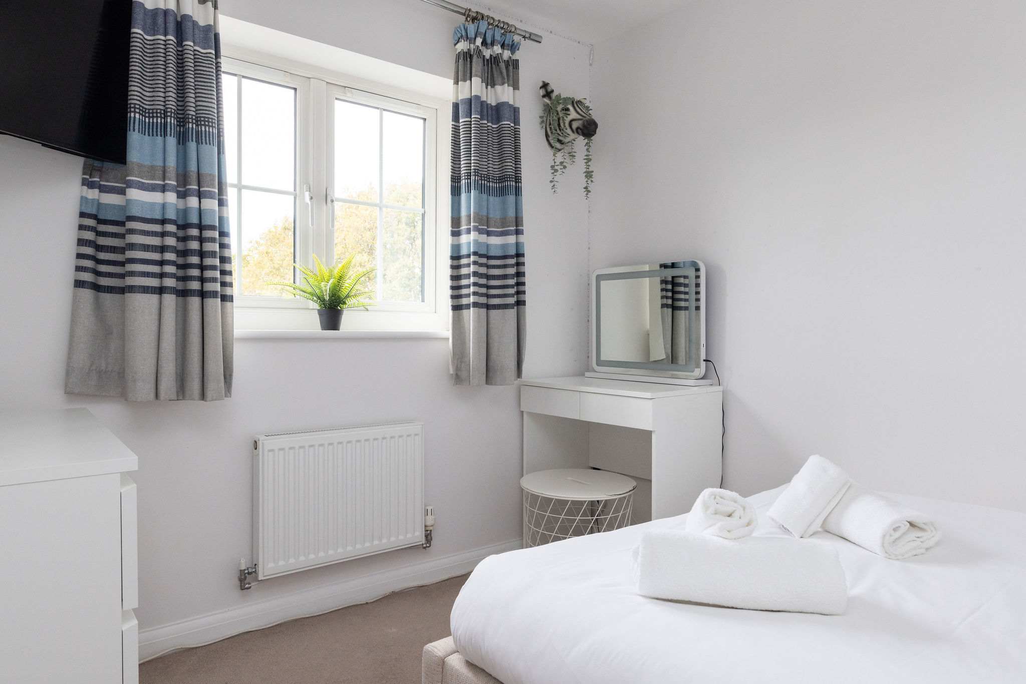 Bright vanity area in a double bedroom.