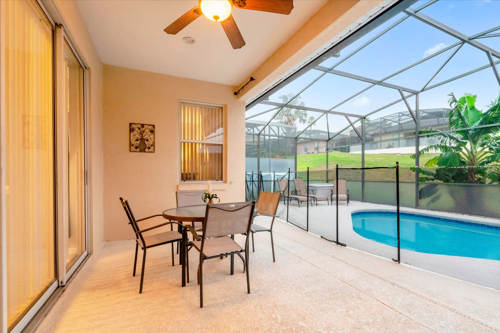 Relax on the private patio with a pool view, perfect for enjoying sunny days and balmy evenings.