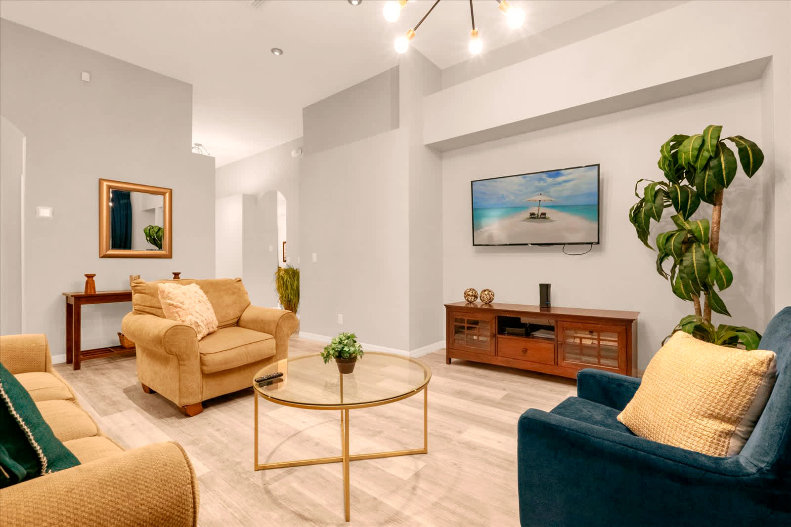 Relax in this stylish living room with modern decor, a cozy seating area, and a large TV for entertainment.