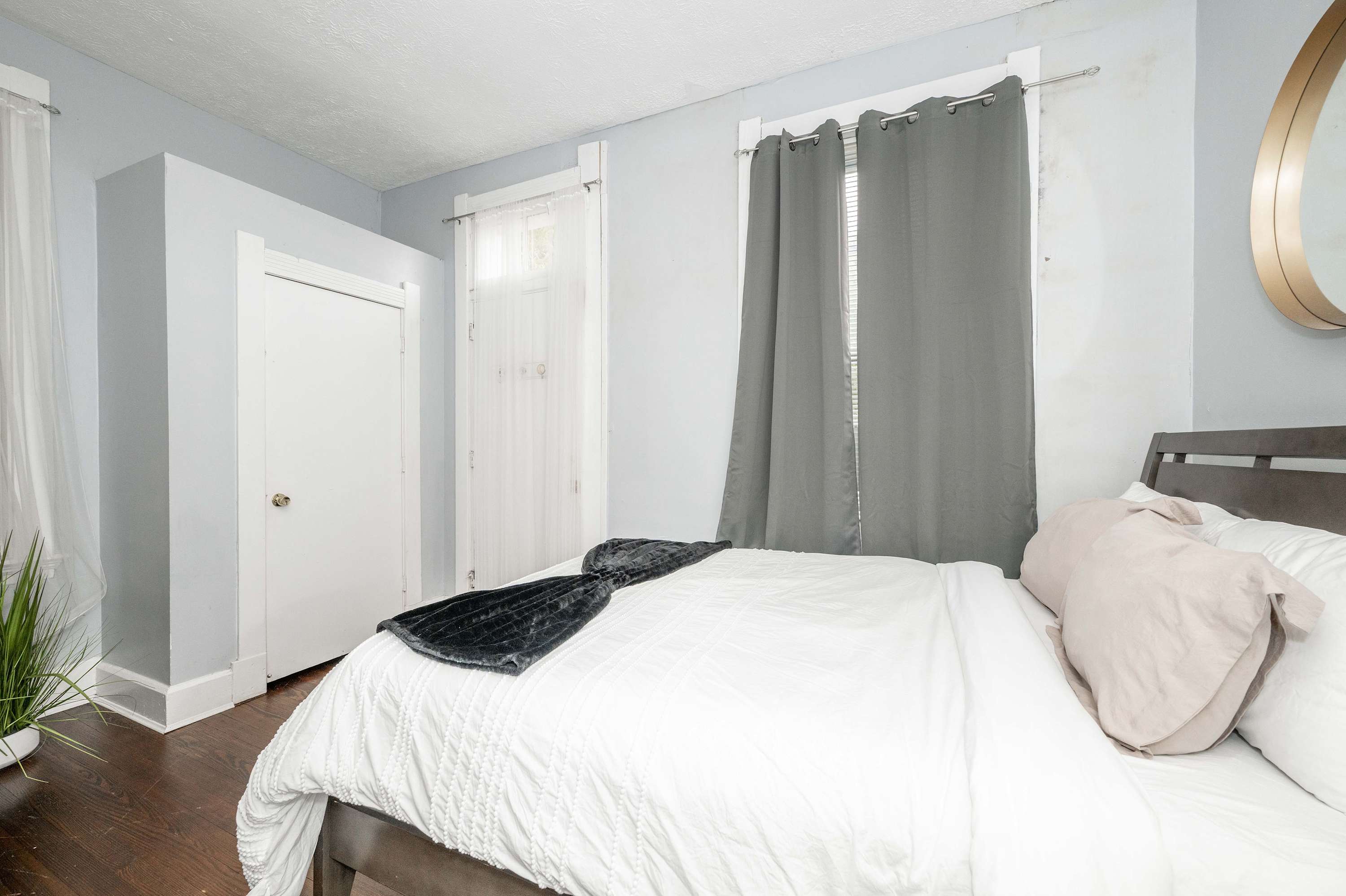 The serene bedroom retreat includes a queen-sized bed & smart TV​