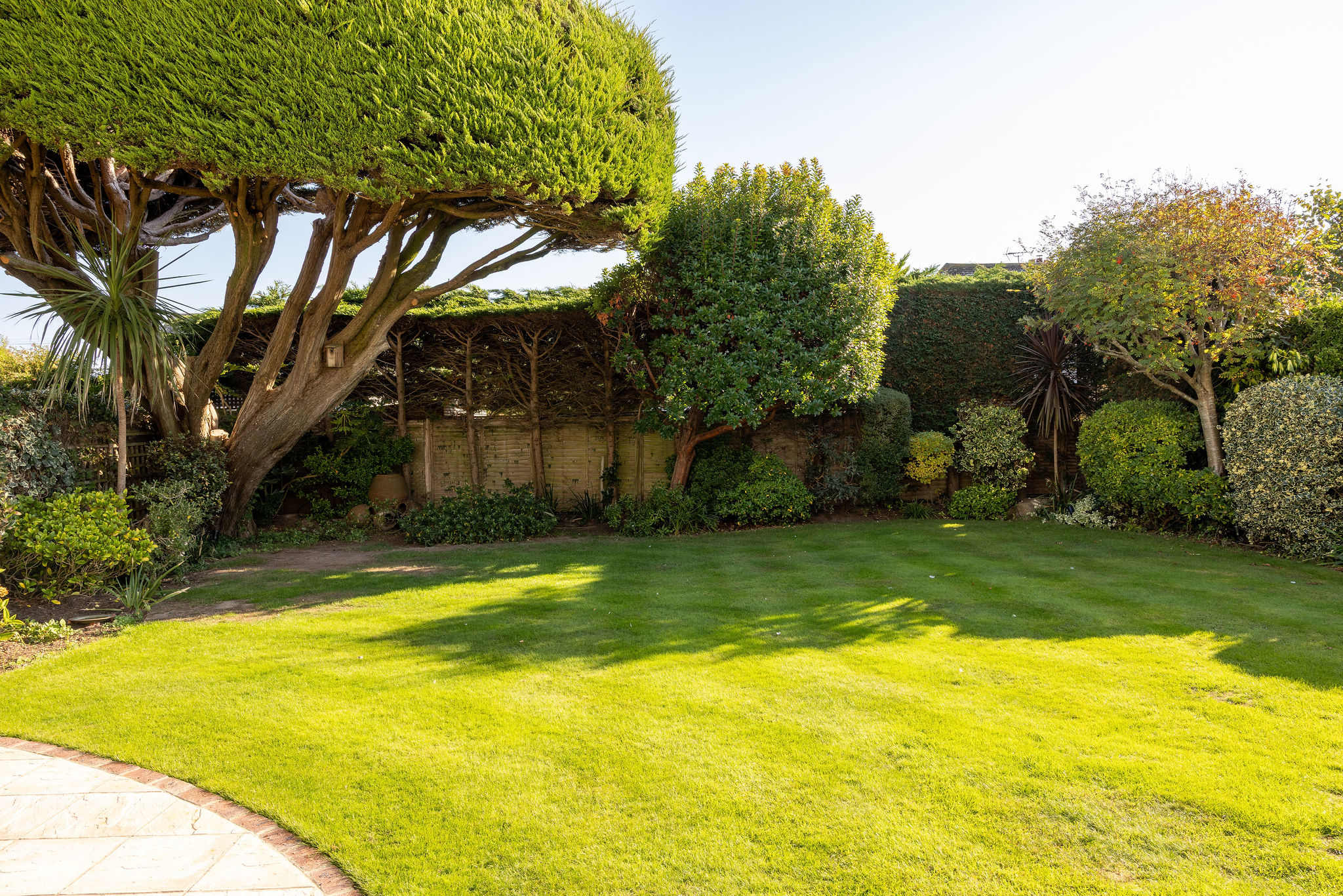 The garden has a large lawned area which children will love to play on.