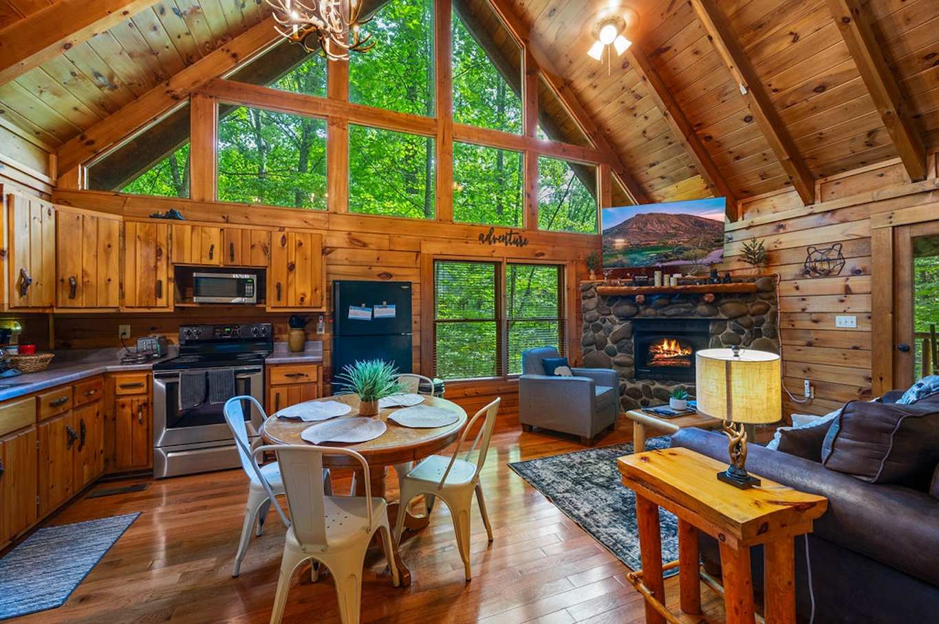 Open concept living: Fireplace, forest views, and a great kitchen!