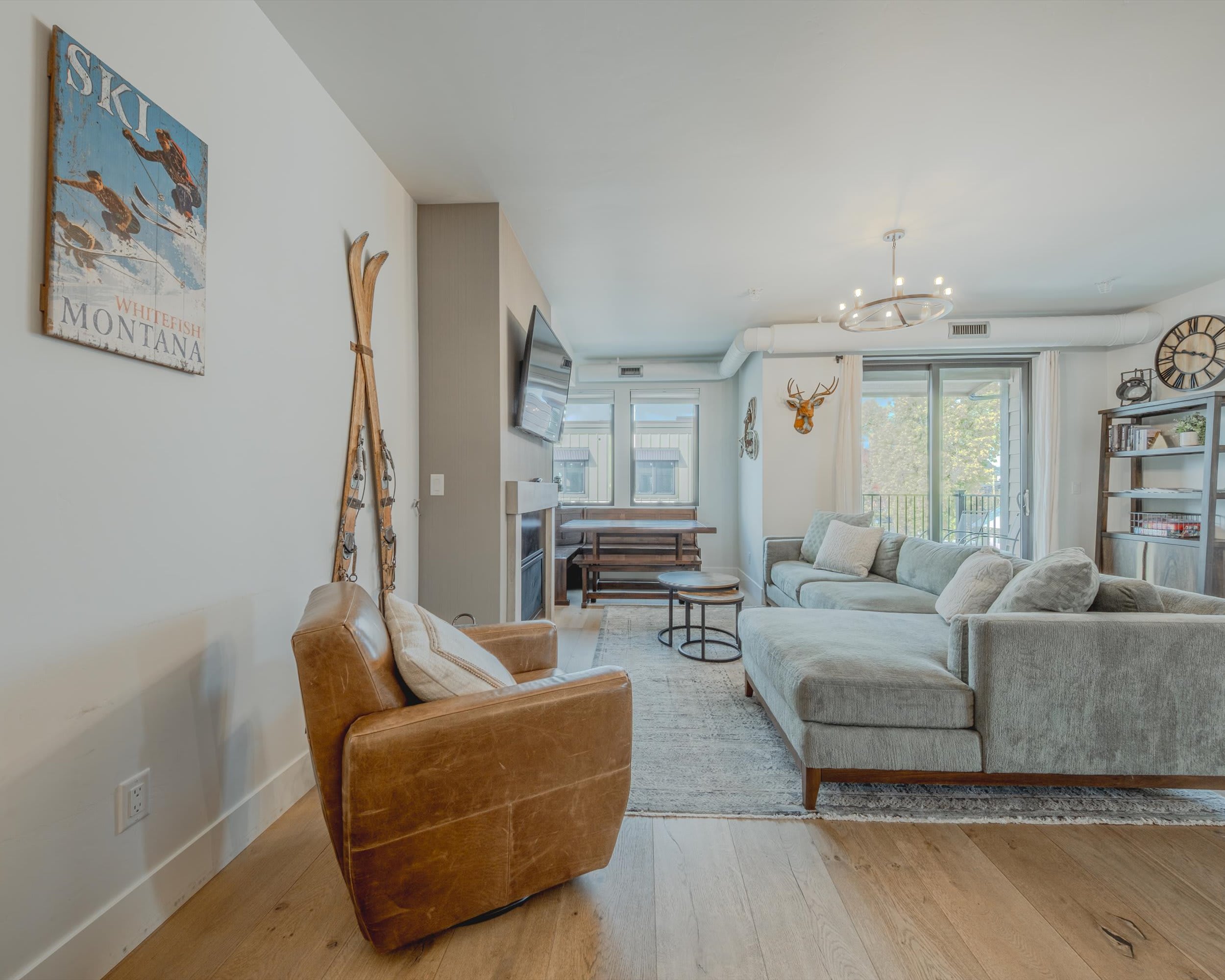 Bright living area with sectional seating and Smart TV