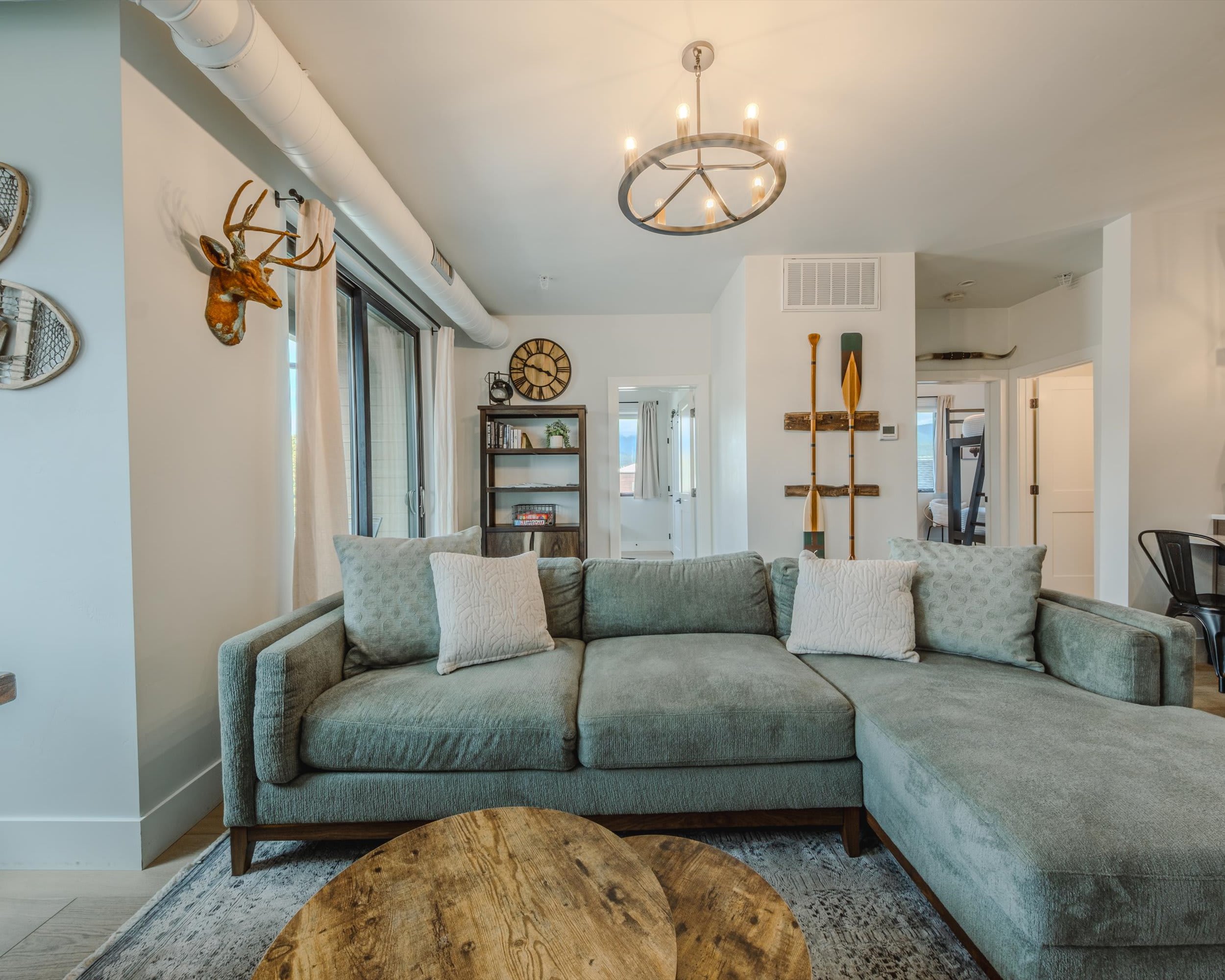 Bright living area with sectional seating and Smart TV