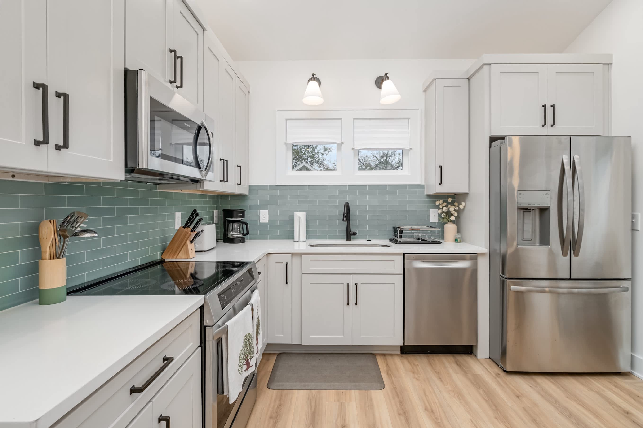 Fully equipped modern kitchen with stainless steel appliances and ample counter space!