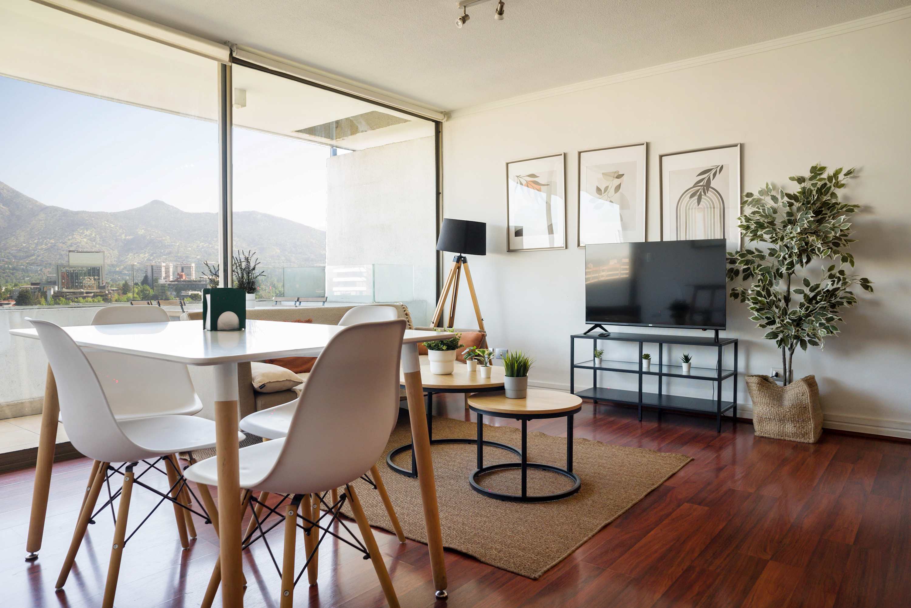 Enjoy stunning mountain views from this stylish living room, perfect for relaxation and dining.