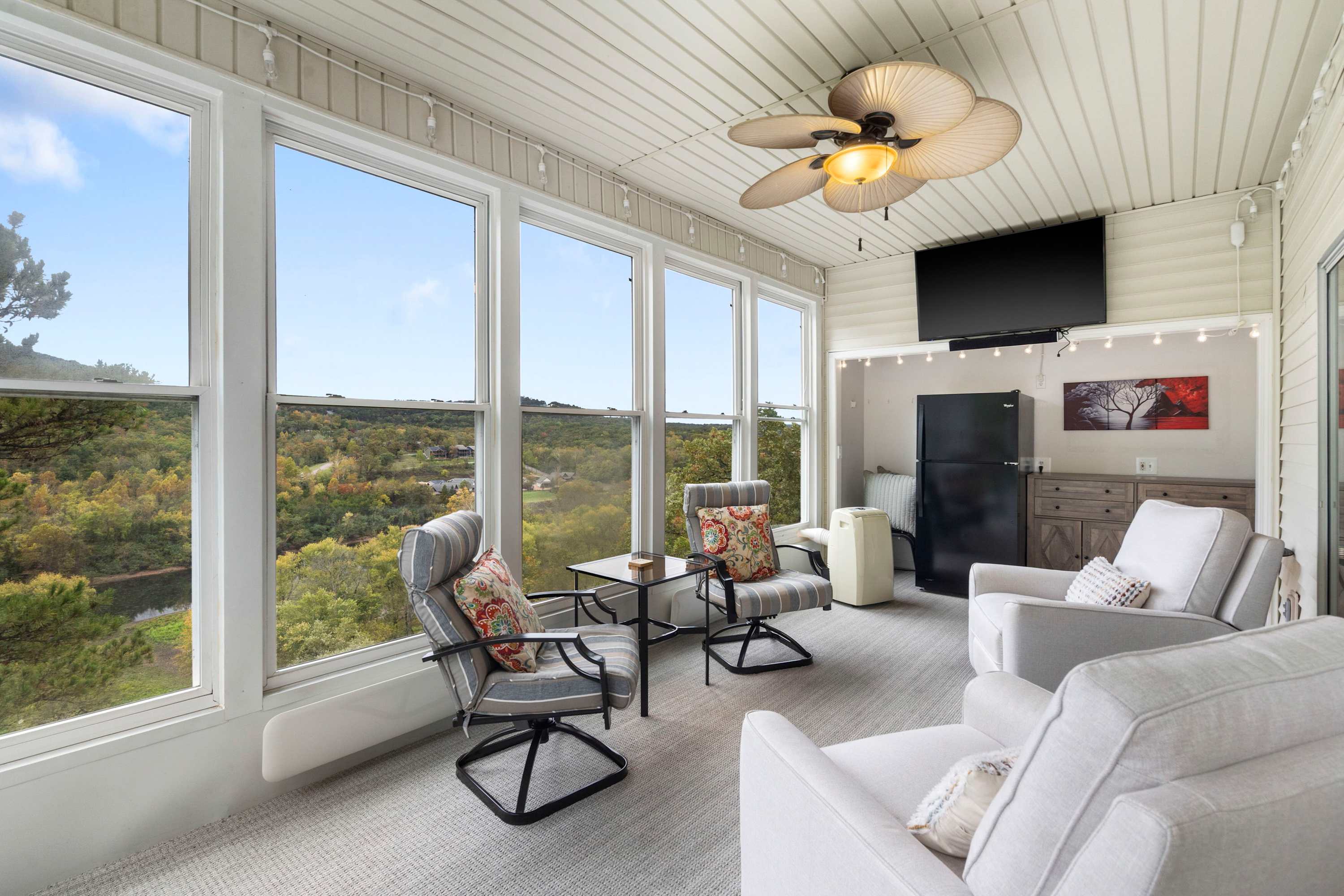 Lounge the day away with stunning views in the breezy sunroom​