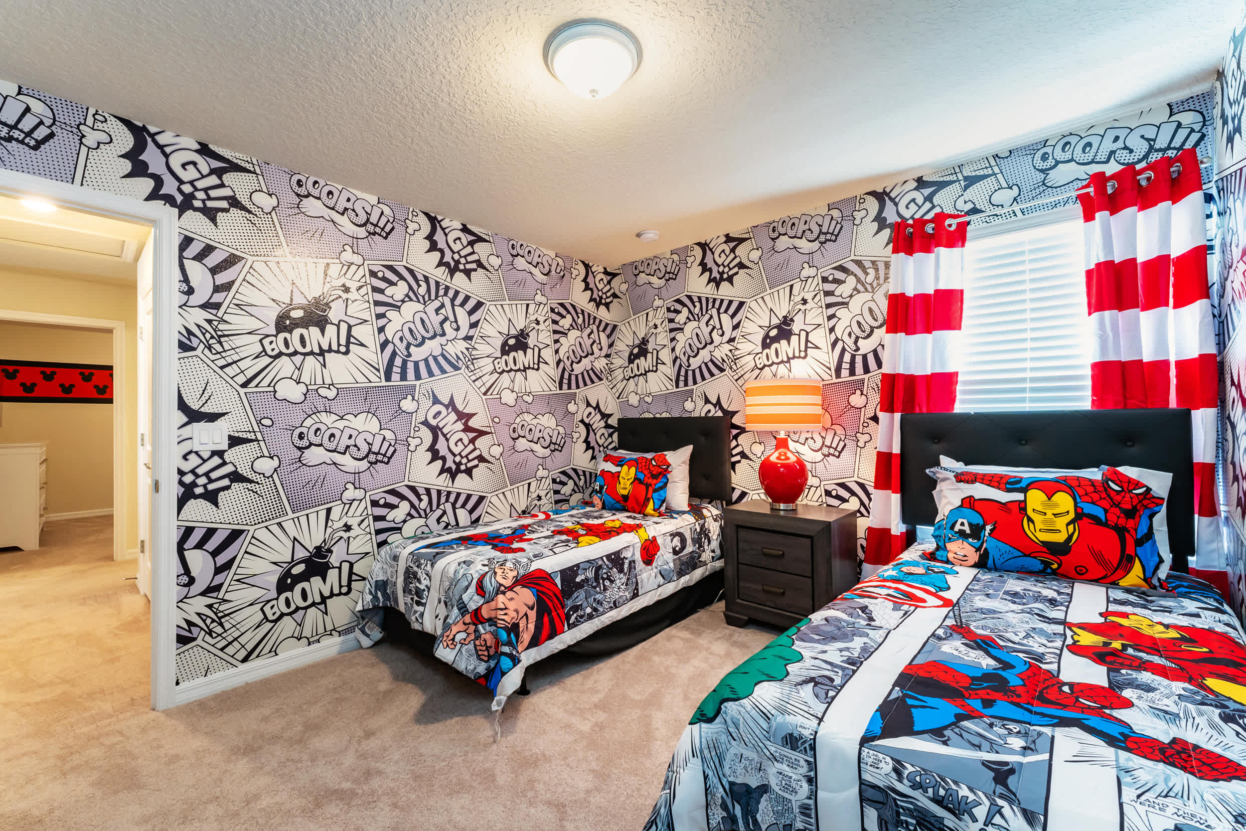 Vibrant superhero-themed bedroom perfect for kids, featuring comic-style decor and cozy twin beds.