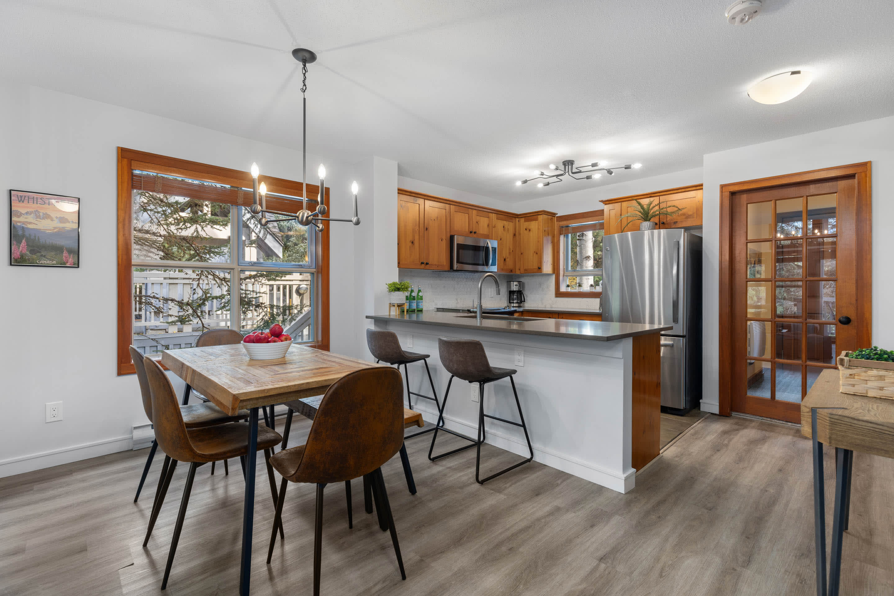 - Spacious dining area set for shared meals and group stays 
- Open layout blends naturally with kitchen and living room 
- Woodland views make every meal feel special 
