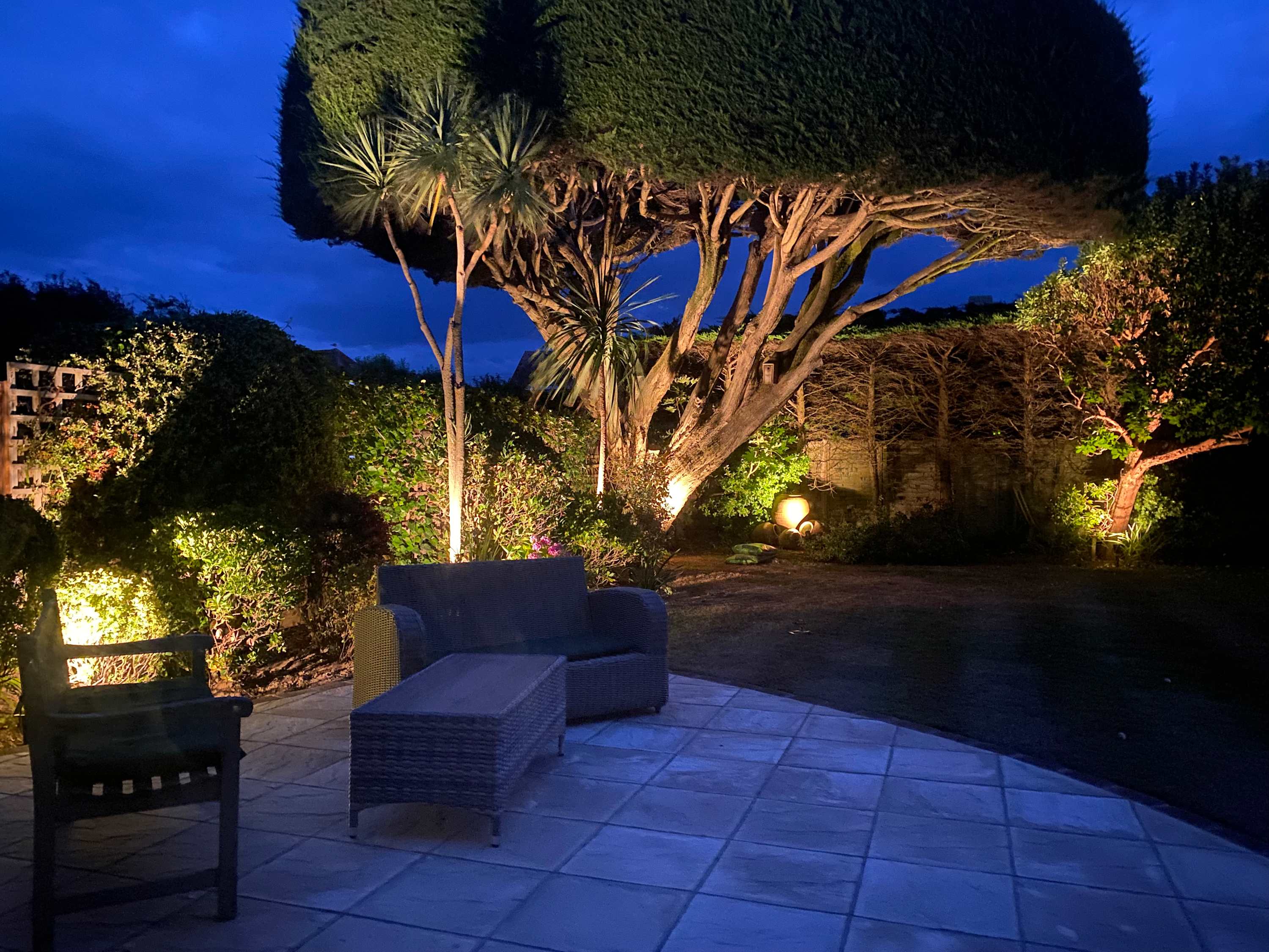 Nighttime glow from the garden's lighting.