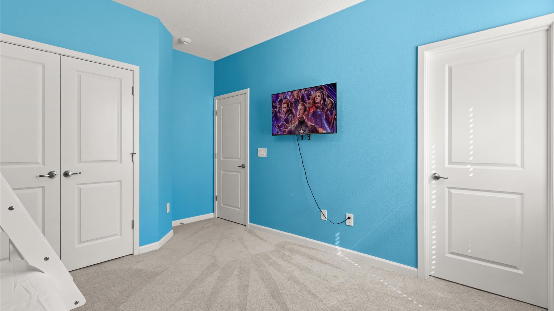 Bedroom 10 – Captain America Themed Room:
Heroic fun awaits in this Captain America–themed bunk room featuring bold wall art, a Smart TV, and a private ensuite — the perfect space for young heroes to relax and recharge.