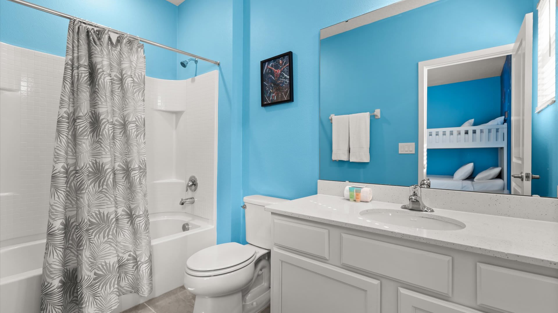 Captain America themed Bunk Bedroom: En-suite bathroom with shower/bathtub combo