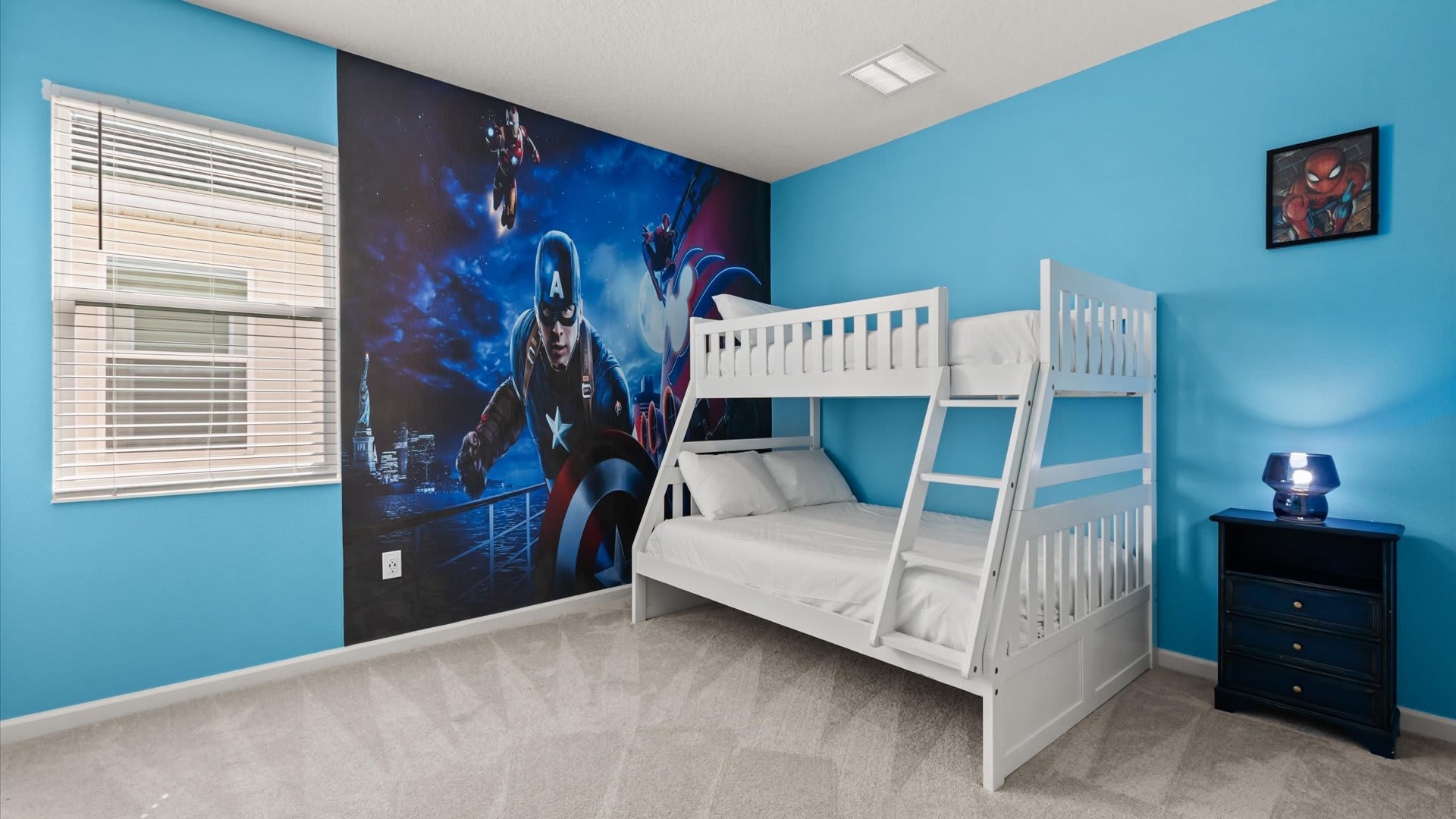 Bedroom 10 – Captain America Themed Room:
Heroic fun awaits in this Captain America–themed bunk room featuring bold wall art, a Smart TV, and a private ensuite — the perfect space for young heroes to relax and recharge.