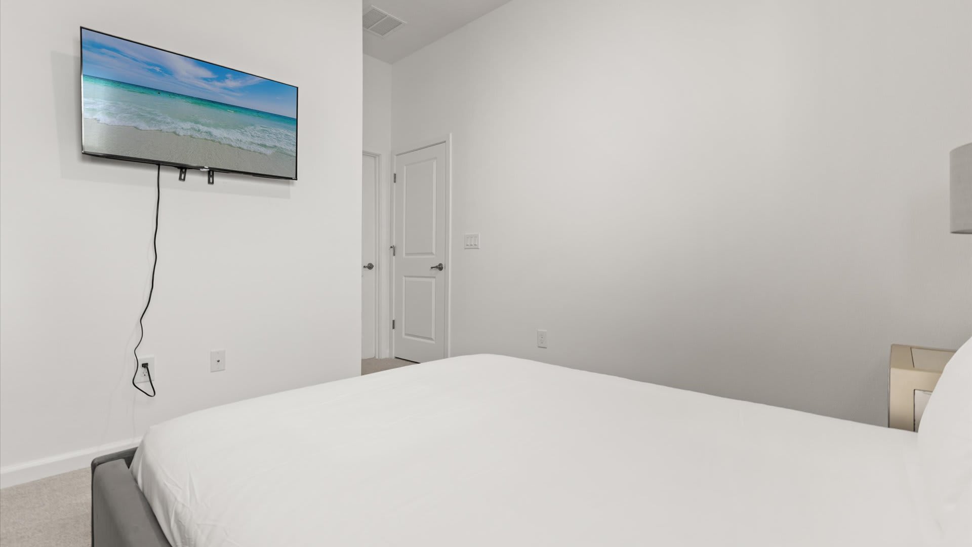 Bedroom 8: Simple yet comfortable queen bedroom with a smart TV.