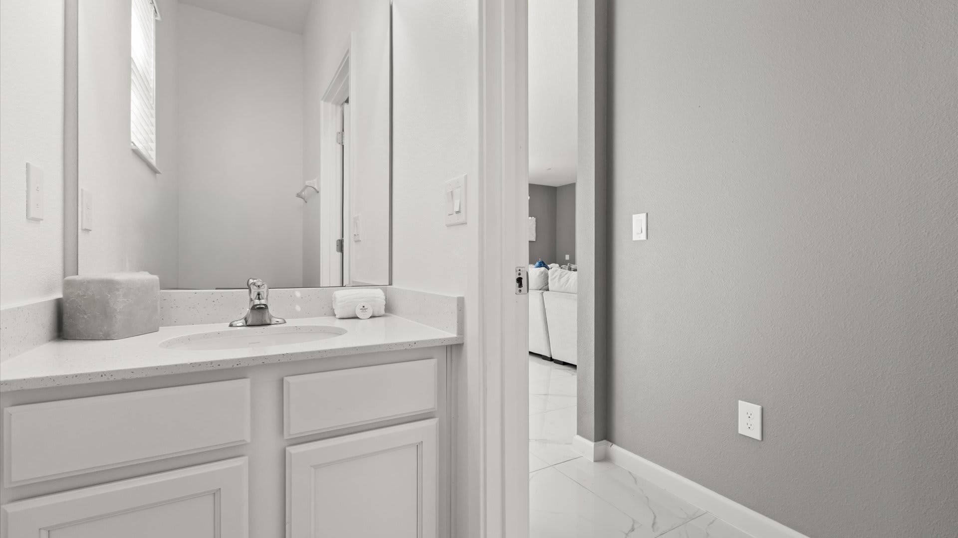 Guest Bathroom: Simple, spotless, and ideal for guests needing easy access.