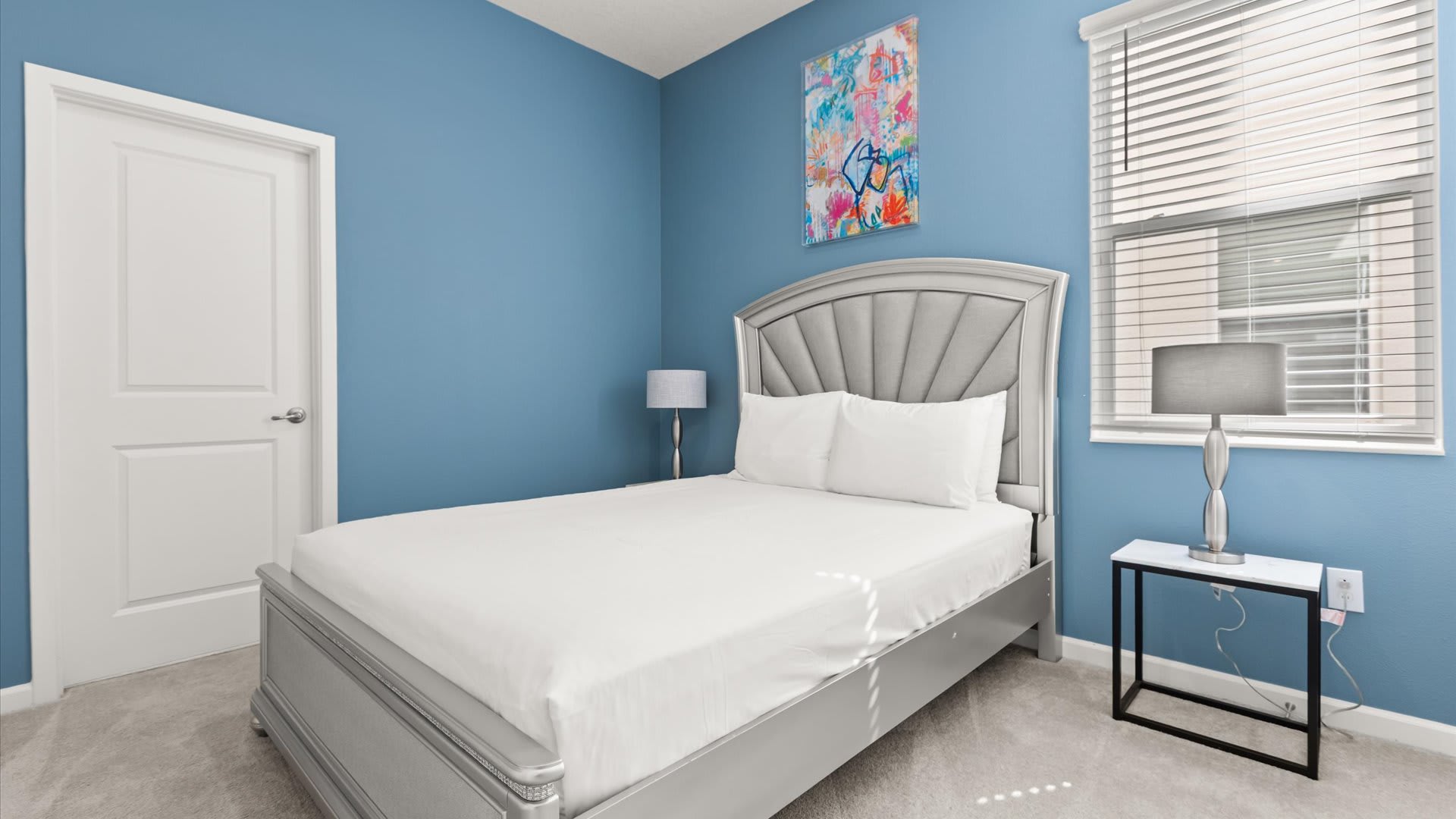 Bedroom 9: Queen Bedroom with cool blue accents and modern decor creates a tranquil retreat for restful nights.