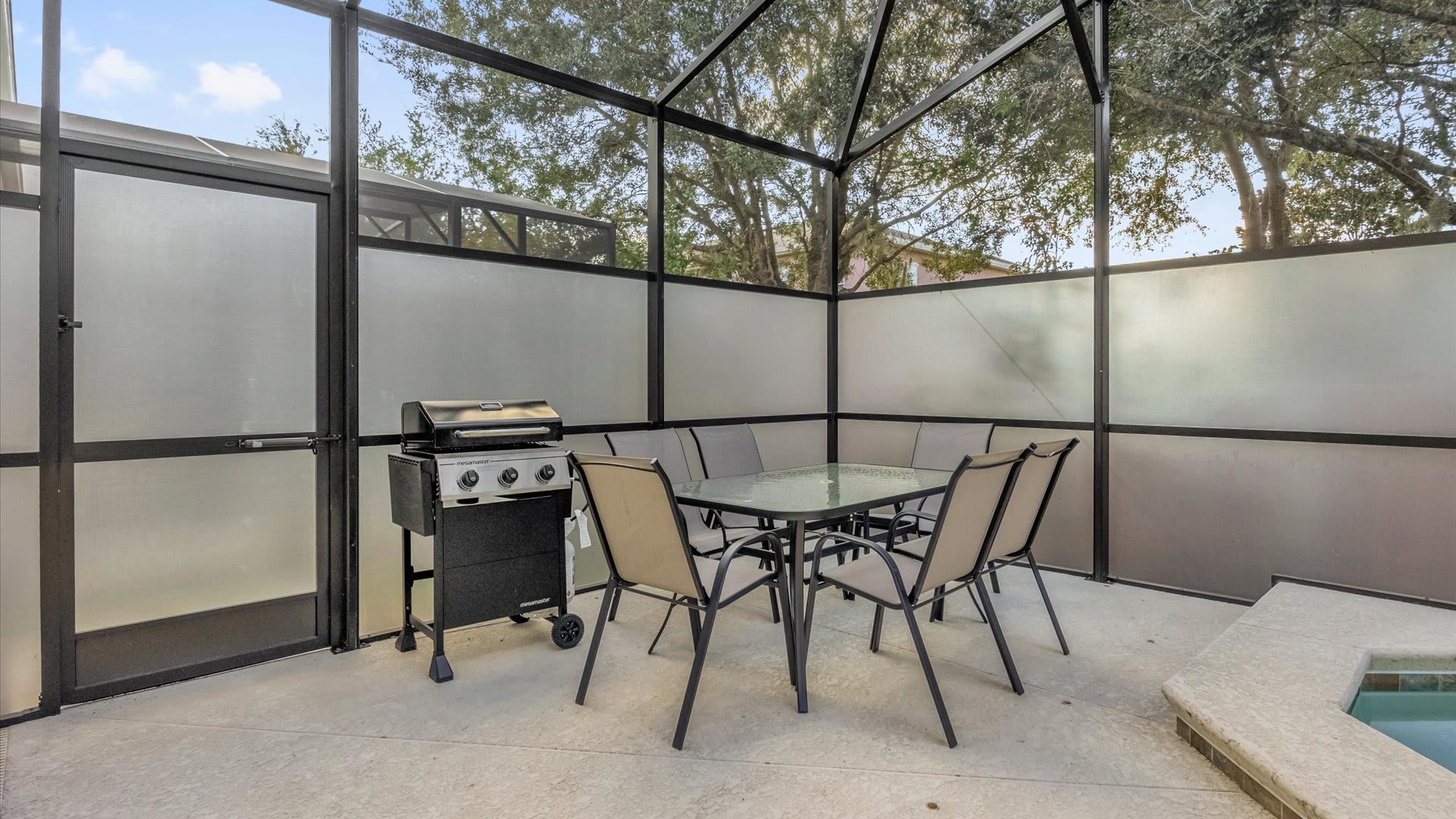 Outdoor Dining Area – Enjoy alfresco meals by the pool with shaded seating and a BBQ grill.