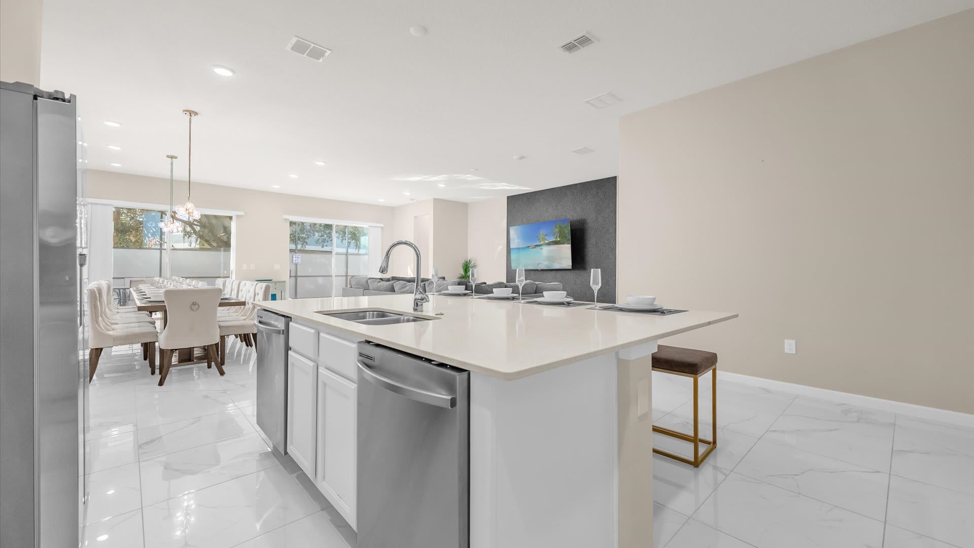 Fully Equipped Modern Kitchen – Sleek stainless-steel appliances, double fridges, and ample prep space.