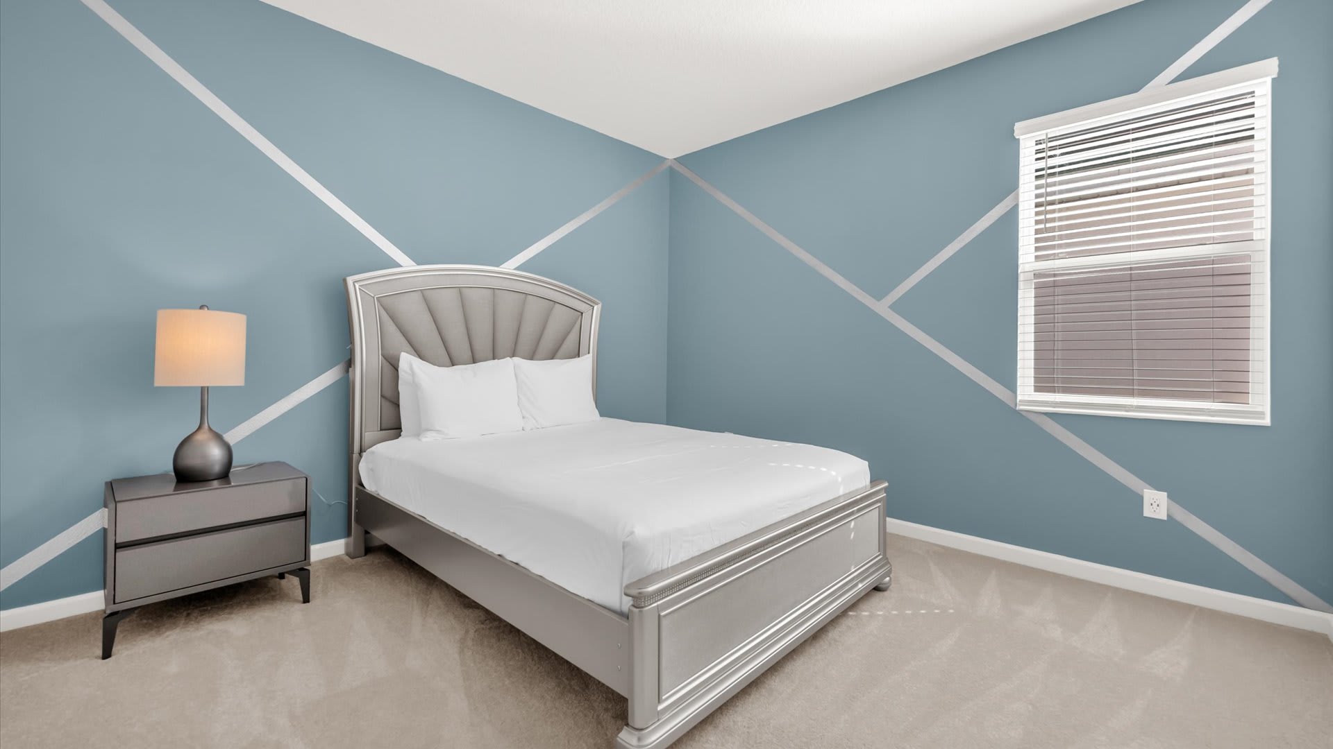 Bedroom 6 – Queen Suite – Contemporary space with soothing blue walls.