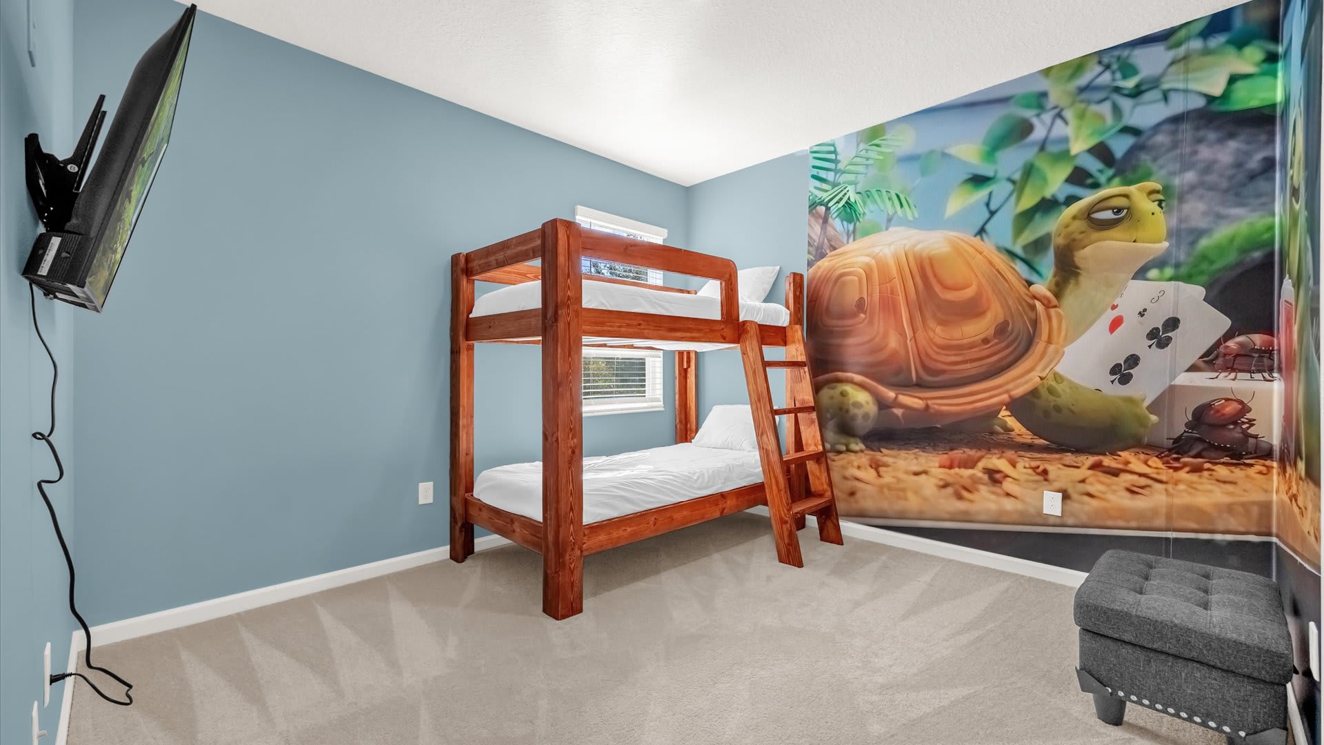 Bedroom 12 – Ninja Turtle-Themed Bunk Room – Colourful ocean-inspired mural and twin bunks for kids.