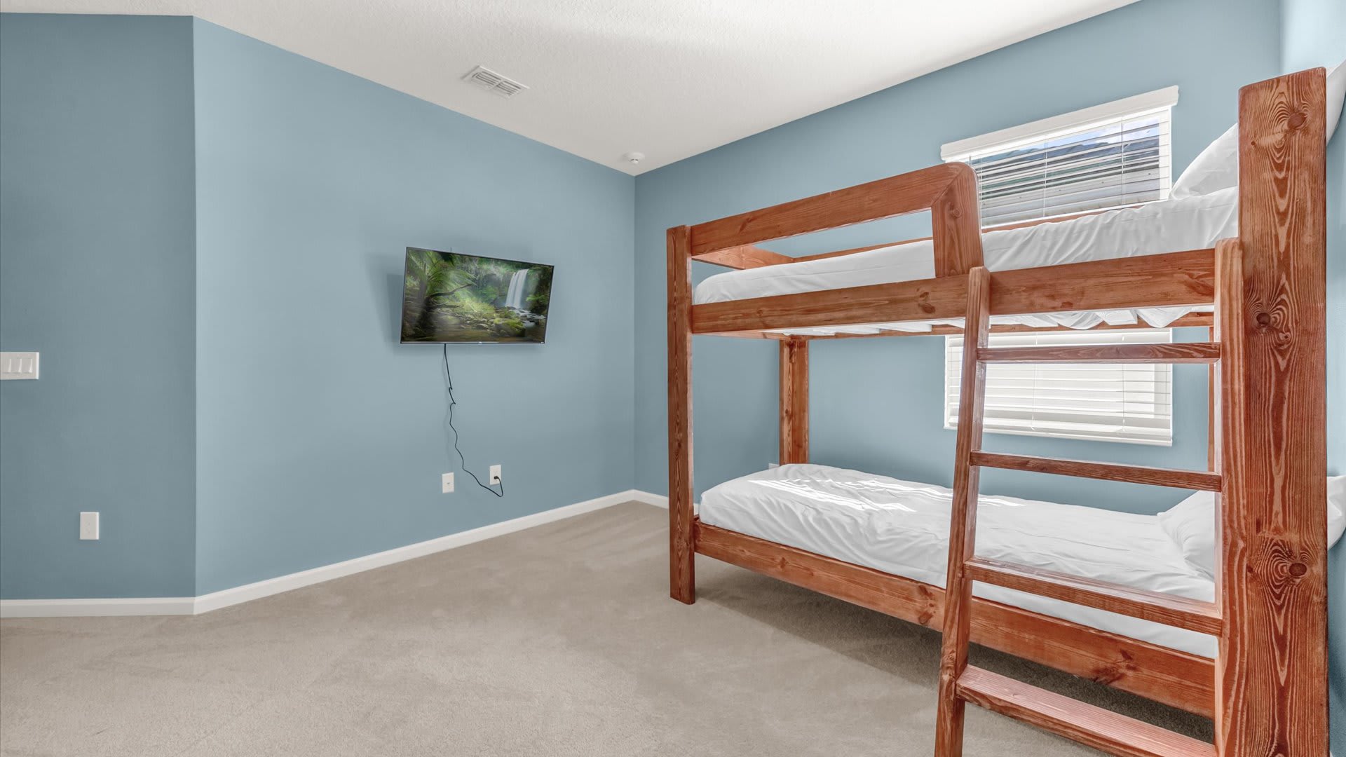 Bedroom 12 – Ninja Turtle-Themed Bunk Room – Colourful ocean-inspired mural and twin bunks for kids.