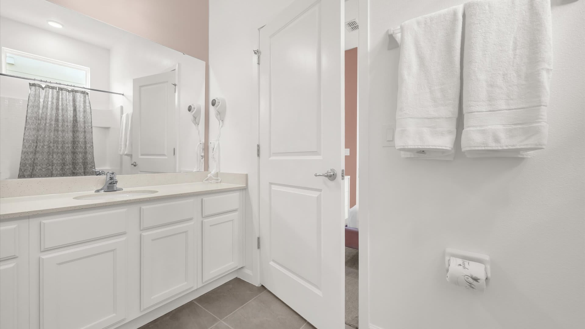 Modern Ensuite Bathroom – Sparkling clean with bathtub and shower combo.