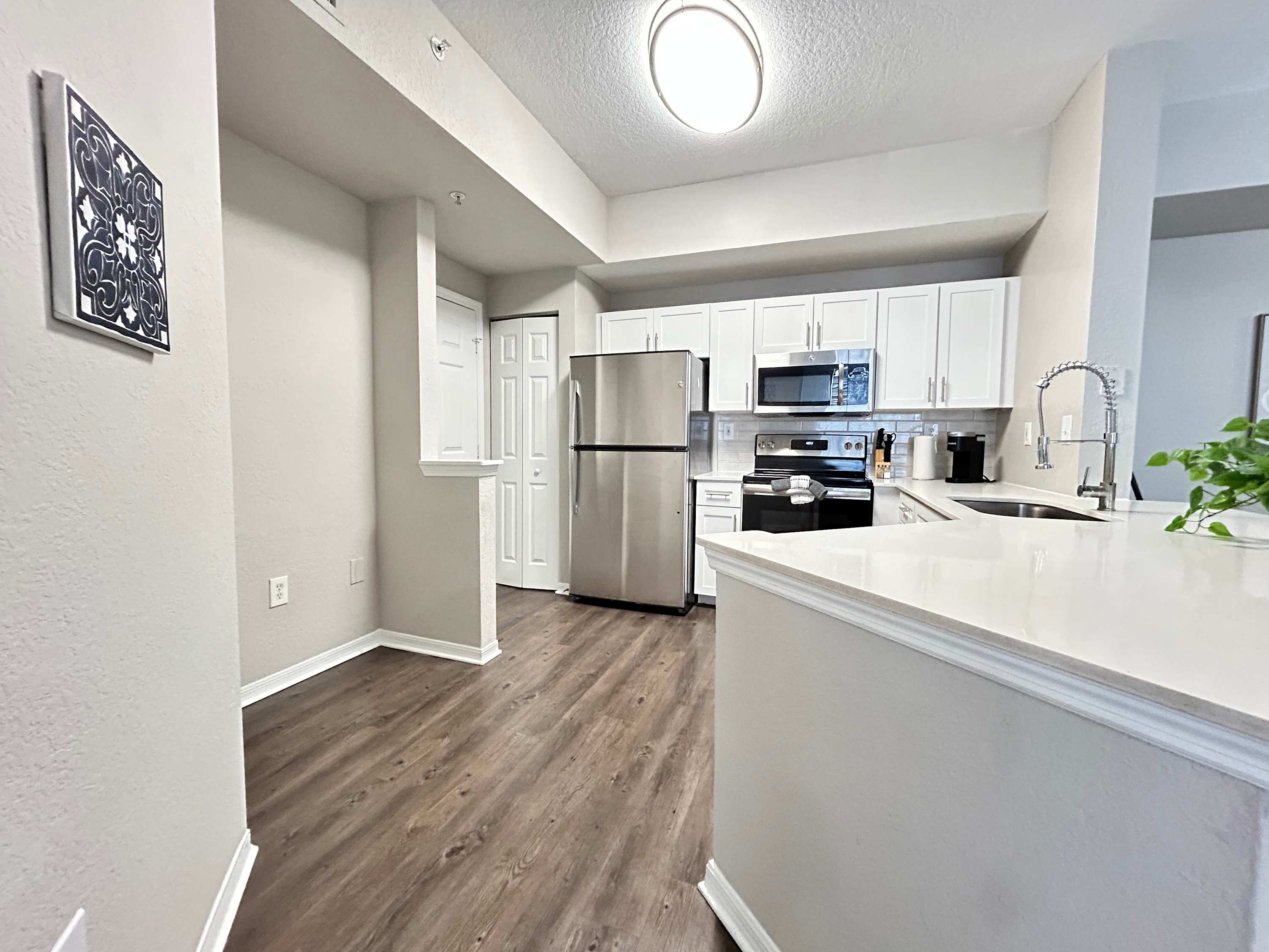 2 BR with Private Garage, Boutique Shops & Pond Views