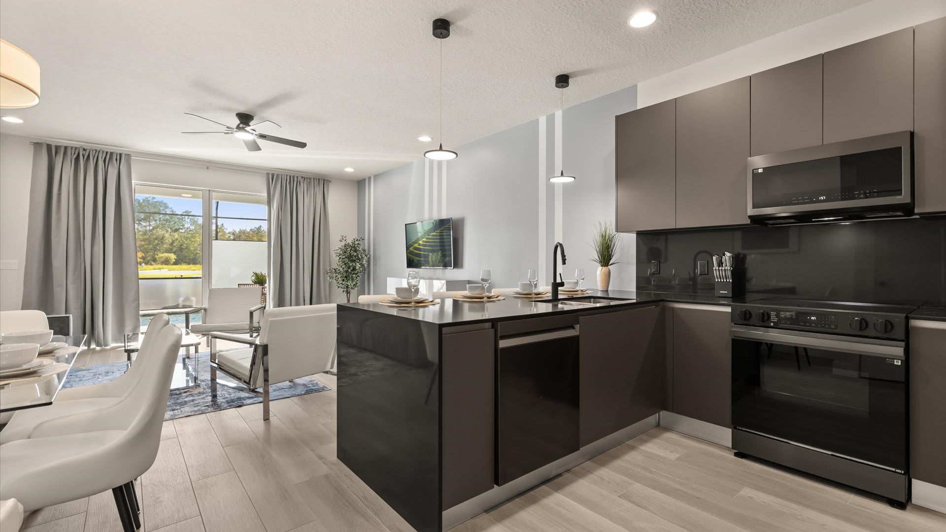 Beautiful fully equipped kitchen with black finishes and modern appliances