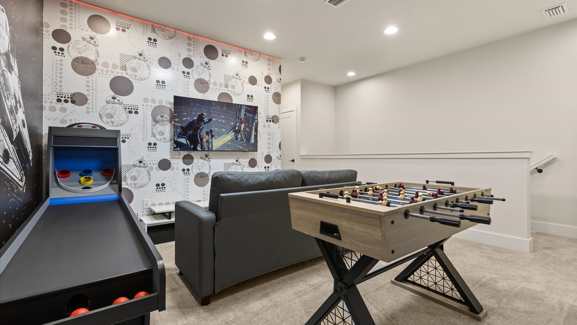 Star Wars themed TV Lounge and Games Room with foosball table and arcade games