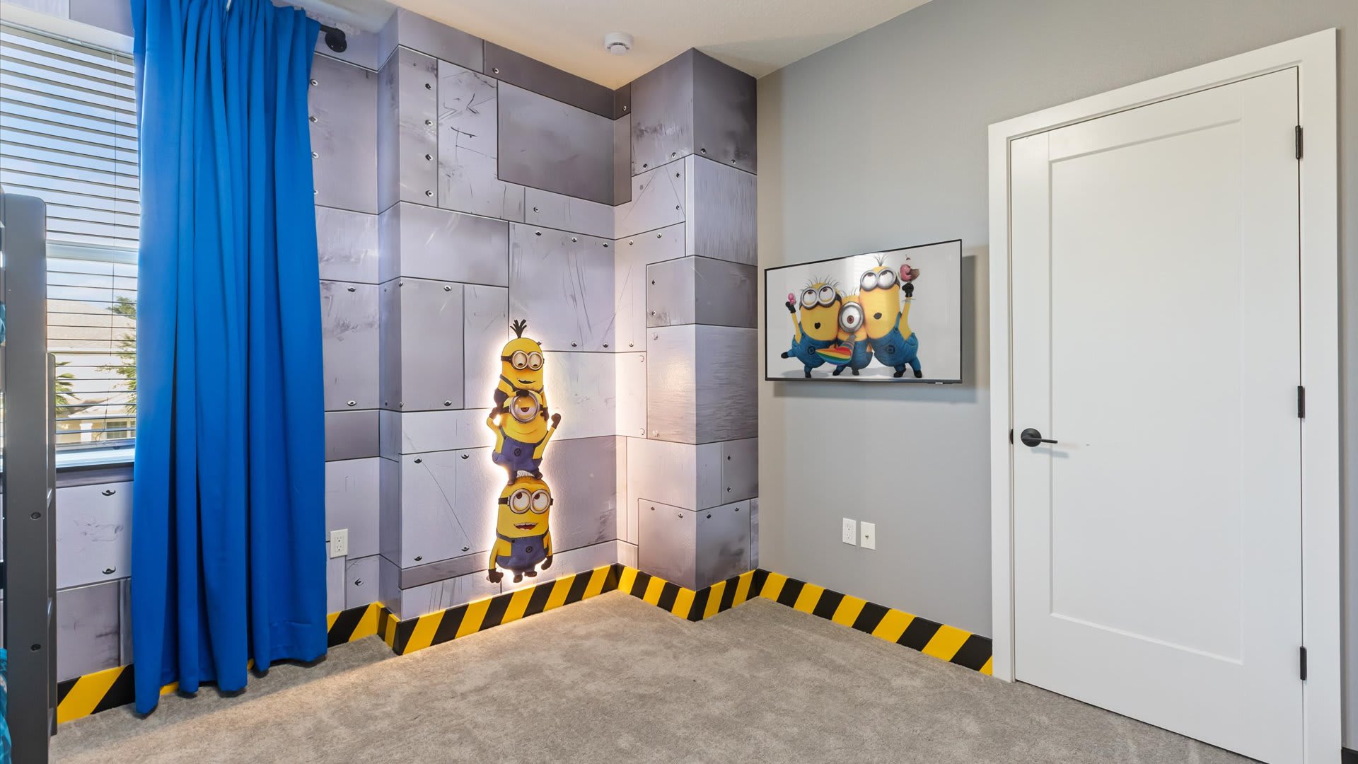 Fun Minions themed bunk bedroom with a smart TV