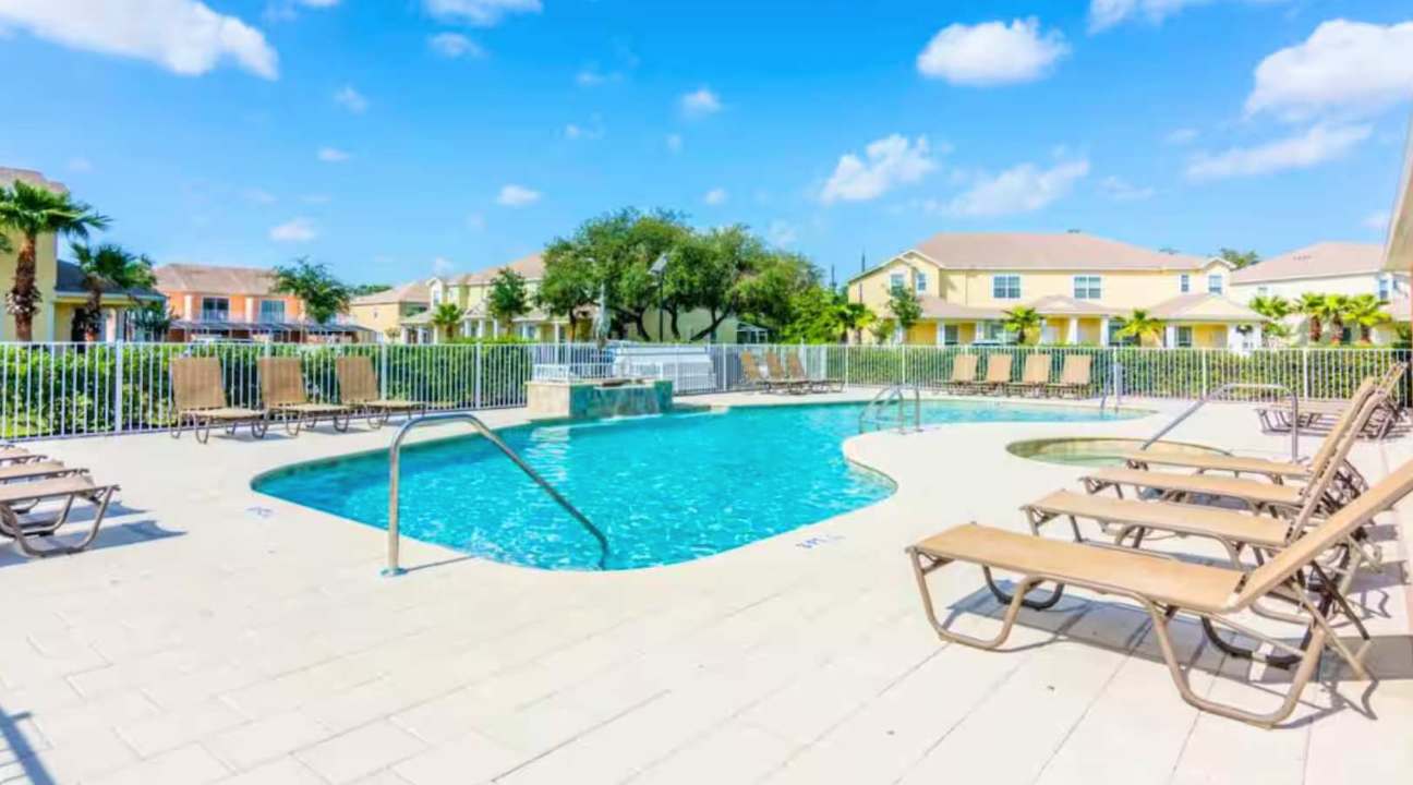 Resort Outdoor Community Pool with Sun Loungers