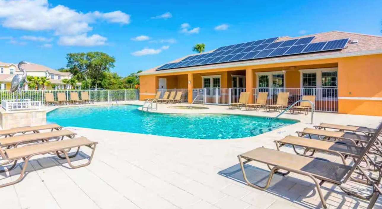 Resort Outdoor Community Pool with Sun Loungers