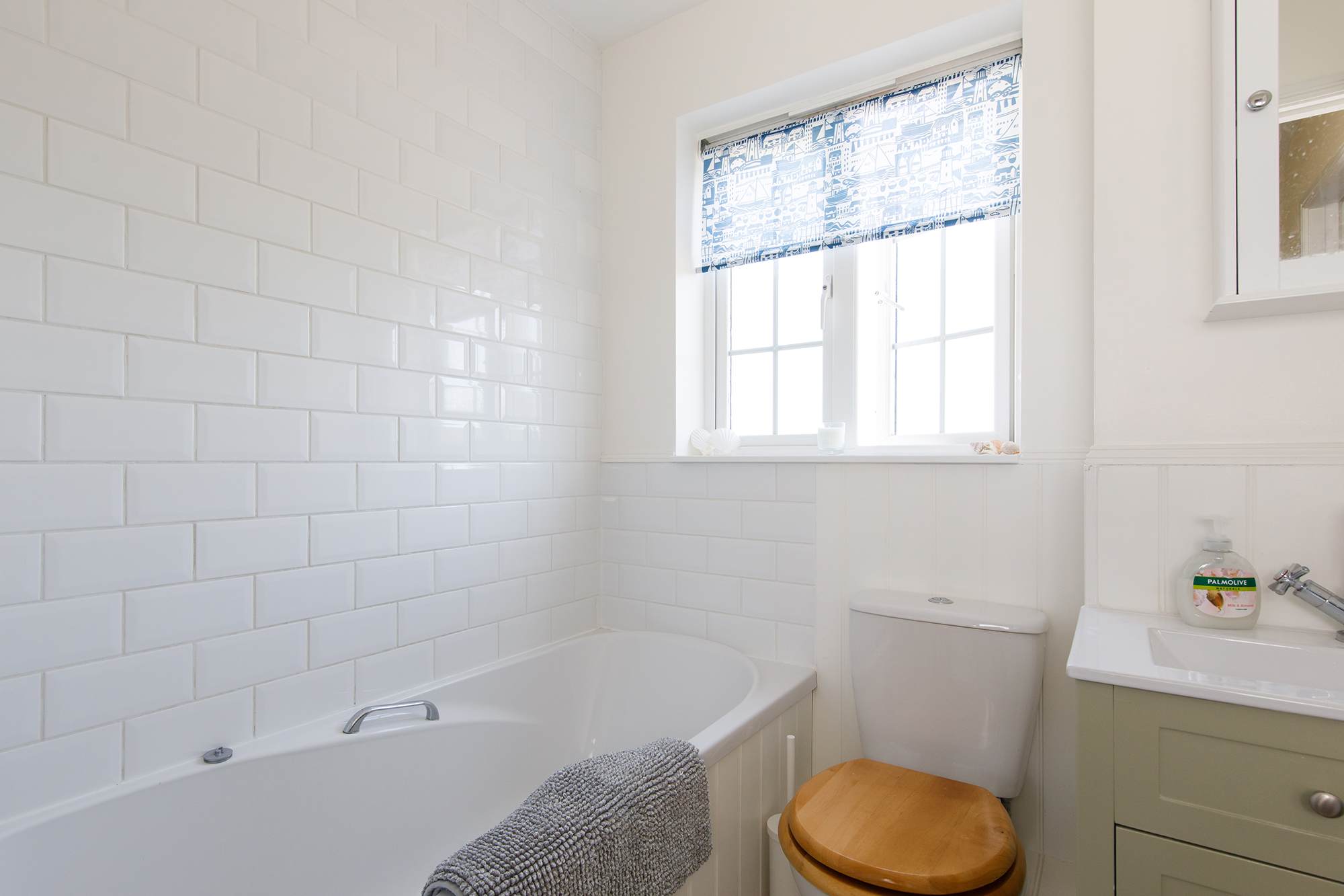 Freshen up in the family bathroom after a day at the beach.