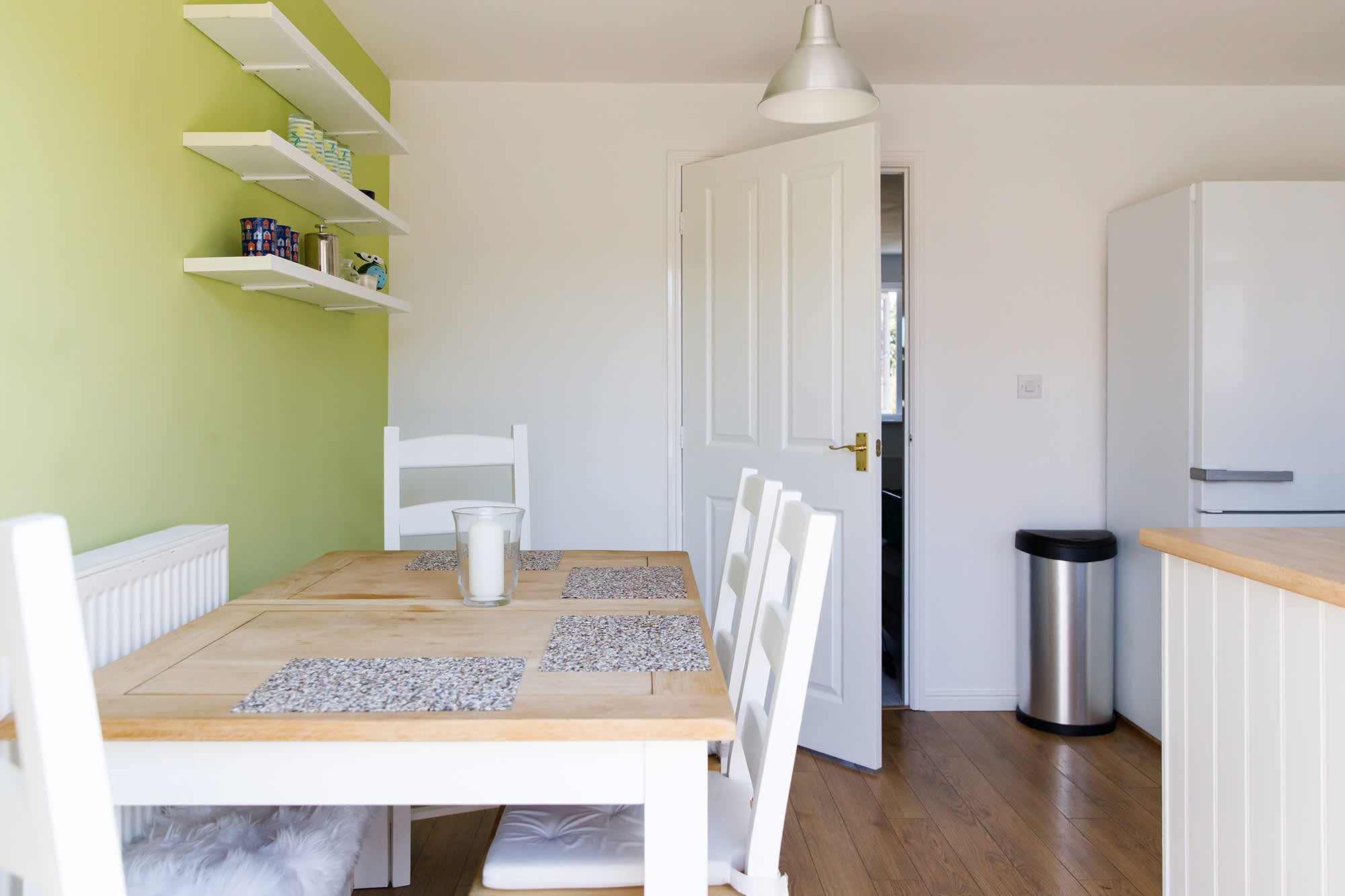 The kitchen has dining space with a table and chairs to seat up to 6 people.