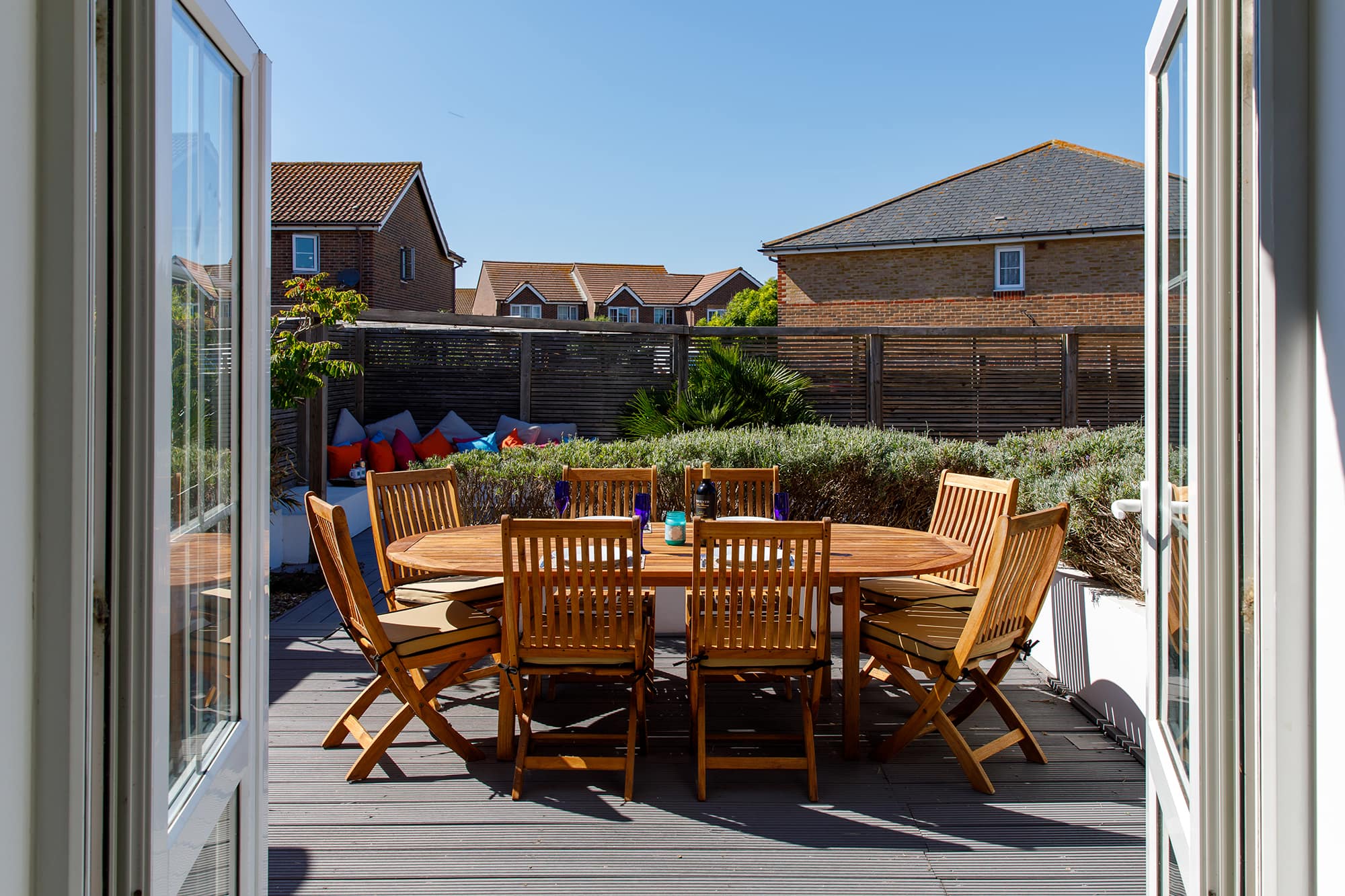 On from the kitchen, is the wonderful garden, with dining furniture, decking and BBQ.