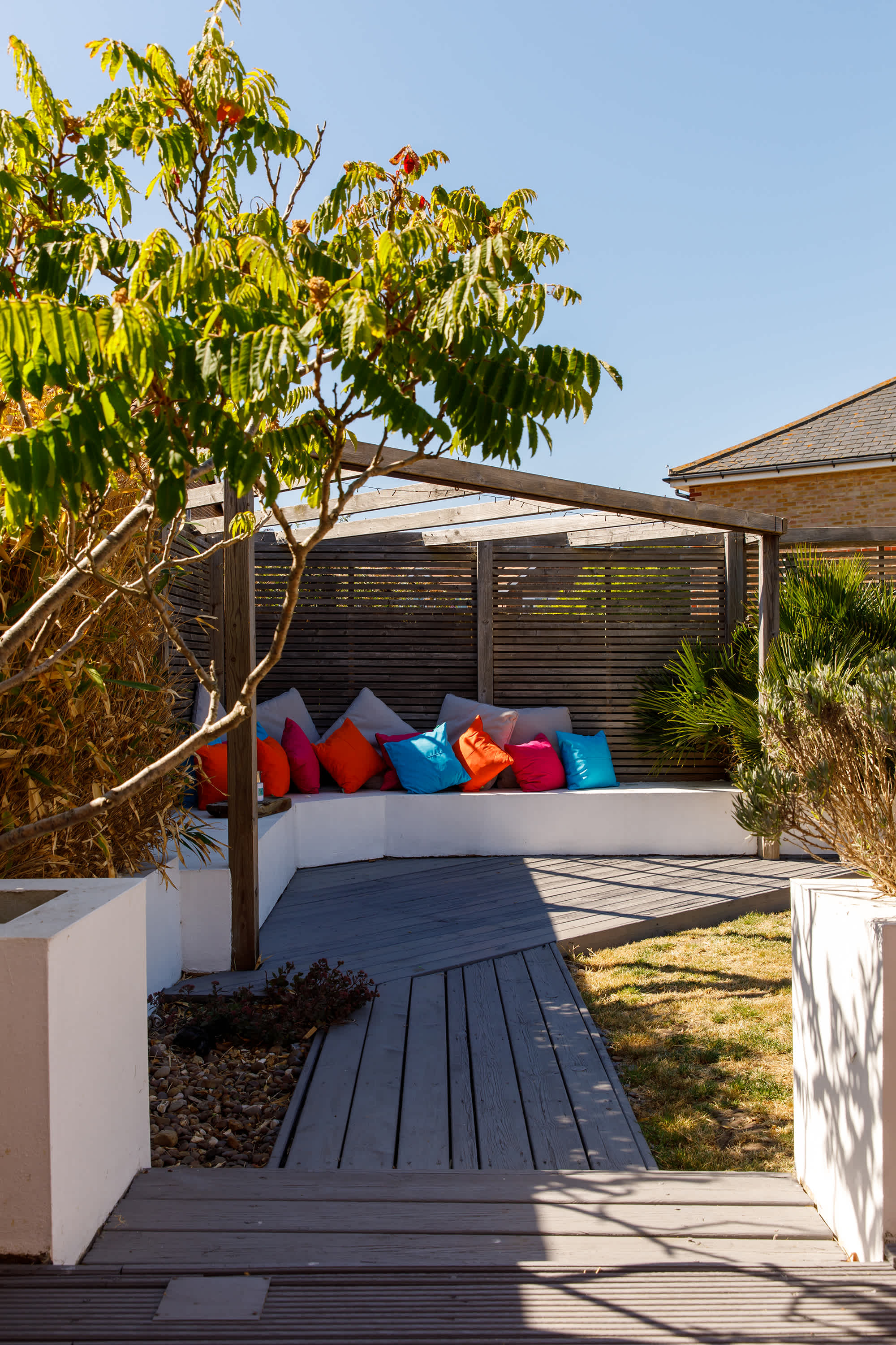The beautifully designed garden has corner seating and decking. Pick your spot, grab a book and unwind.