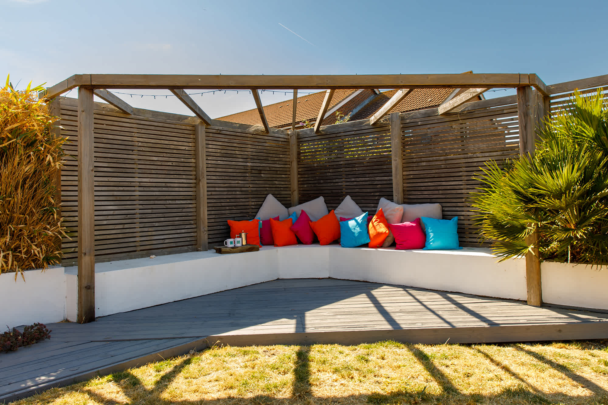 The in-built corner seating with decking is the perfect spot for a morning coffee or evening drink.