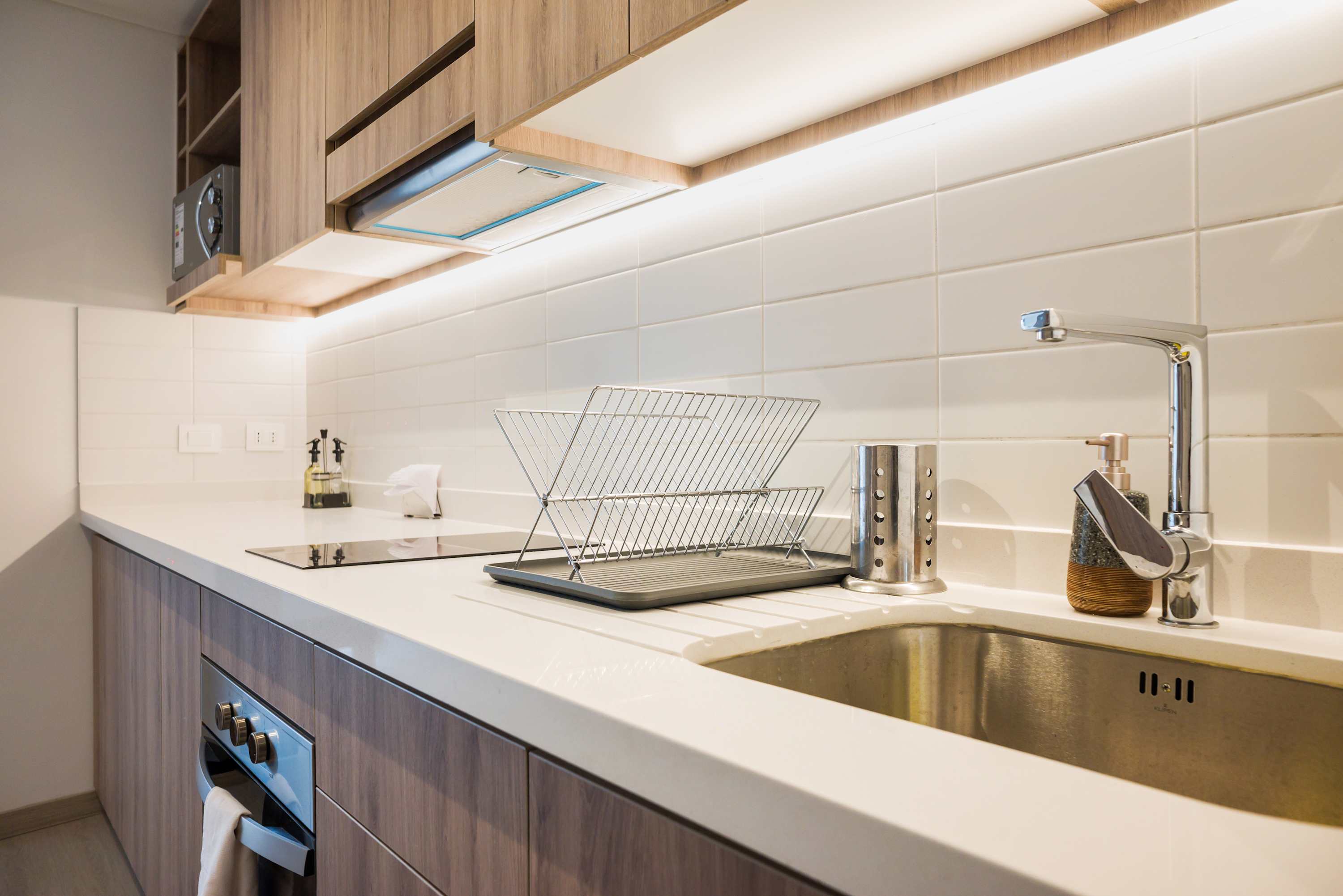 Stylish kitchen with modern amenities, perfect for culinary adventures in a cozy studio setting.