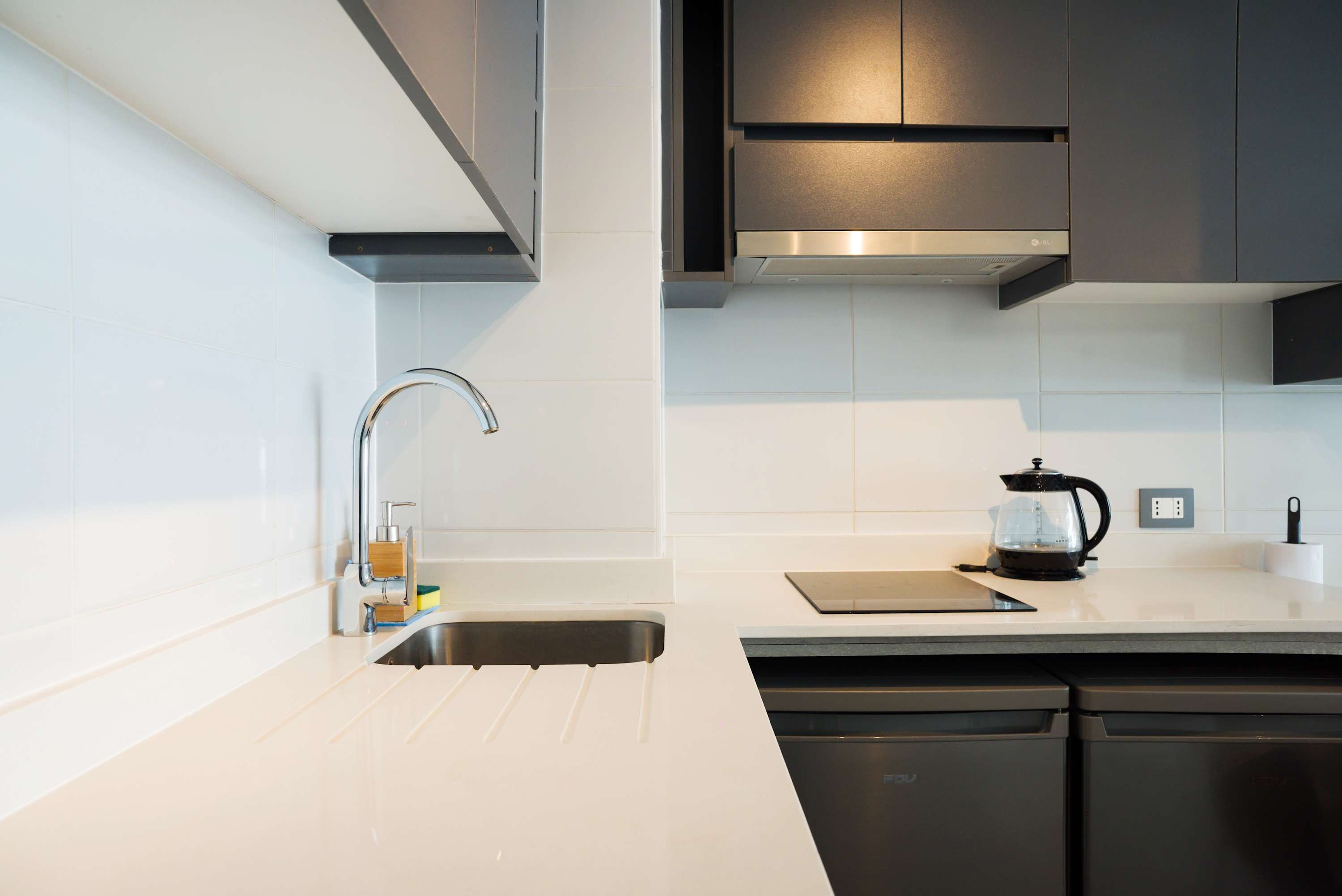Sleek and modern kitchen with top-notch appliances, perfect for preparing meals during your stay.