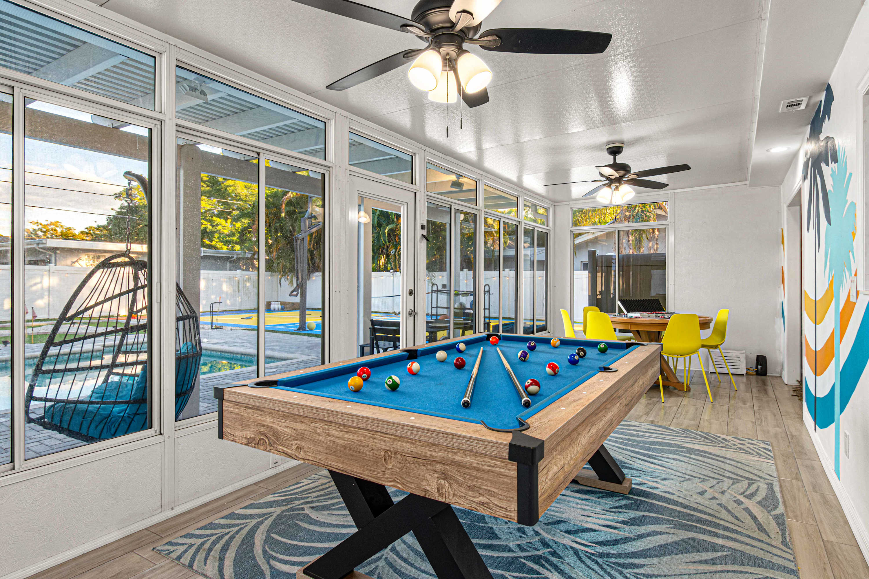 The game room pool table , the room also has 2 ceiling fans