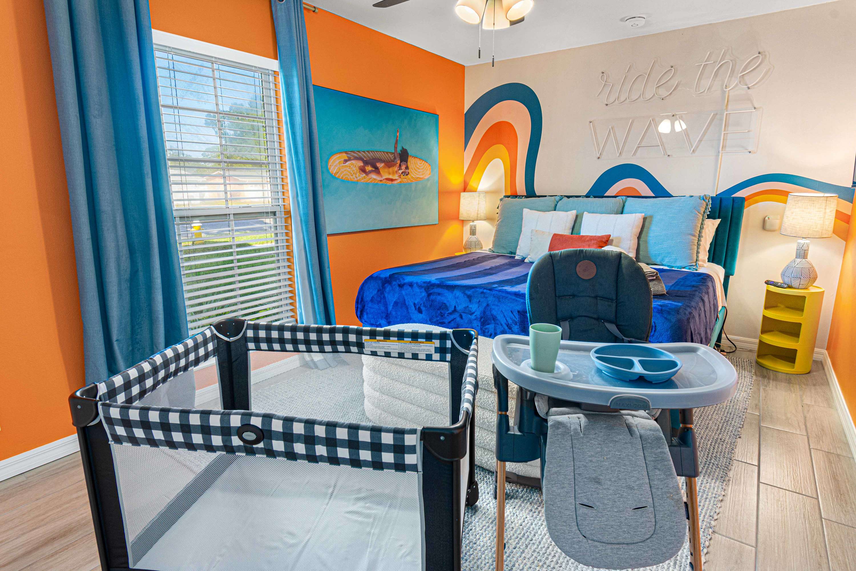 King Bedroom with the kids' high chair and pack and play available for hire, subject to availability