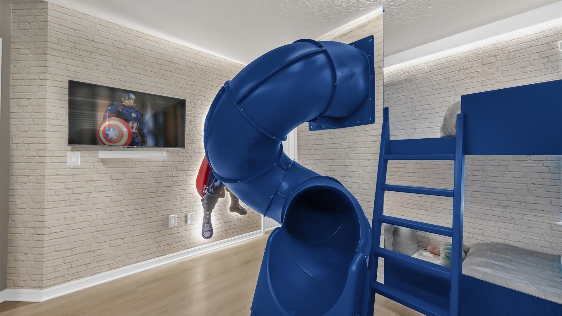 Marvel Avengers-themed bunk bedroom with slide and vibrant superhero graphics.