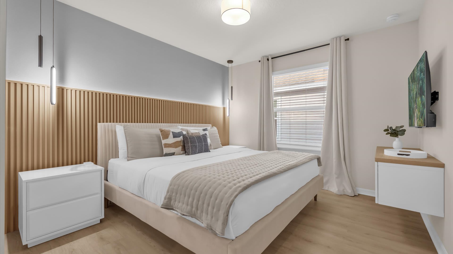 Stylish King Bedroom with en-suite bathroom and modern decor.